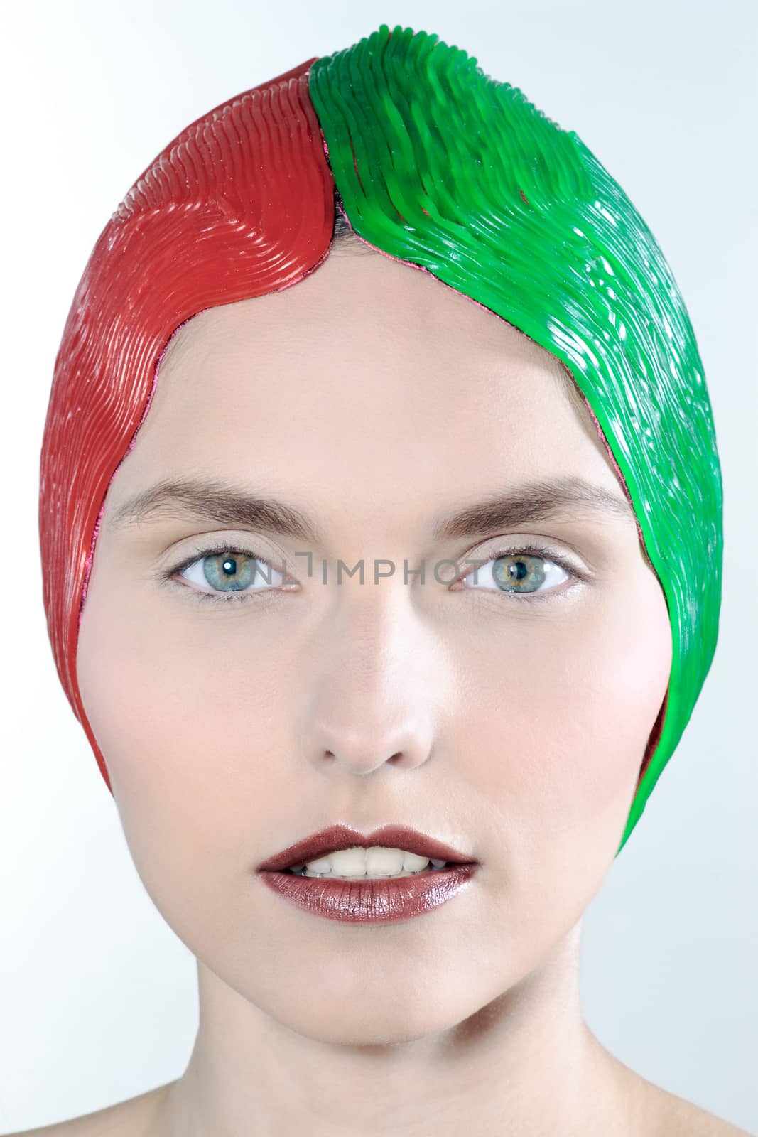 studio shot beauty portrait beautiful green eyes young caucasian woman on a grey background red green cap
