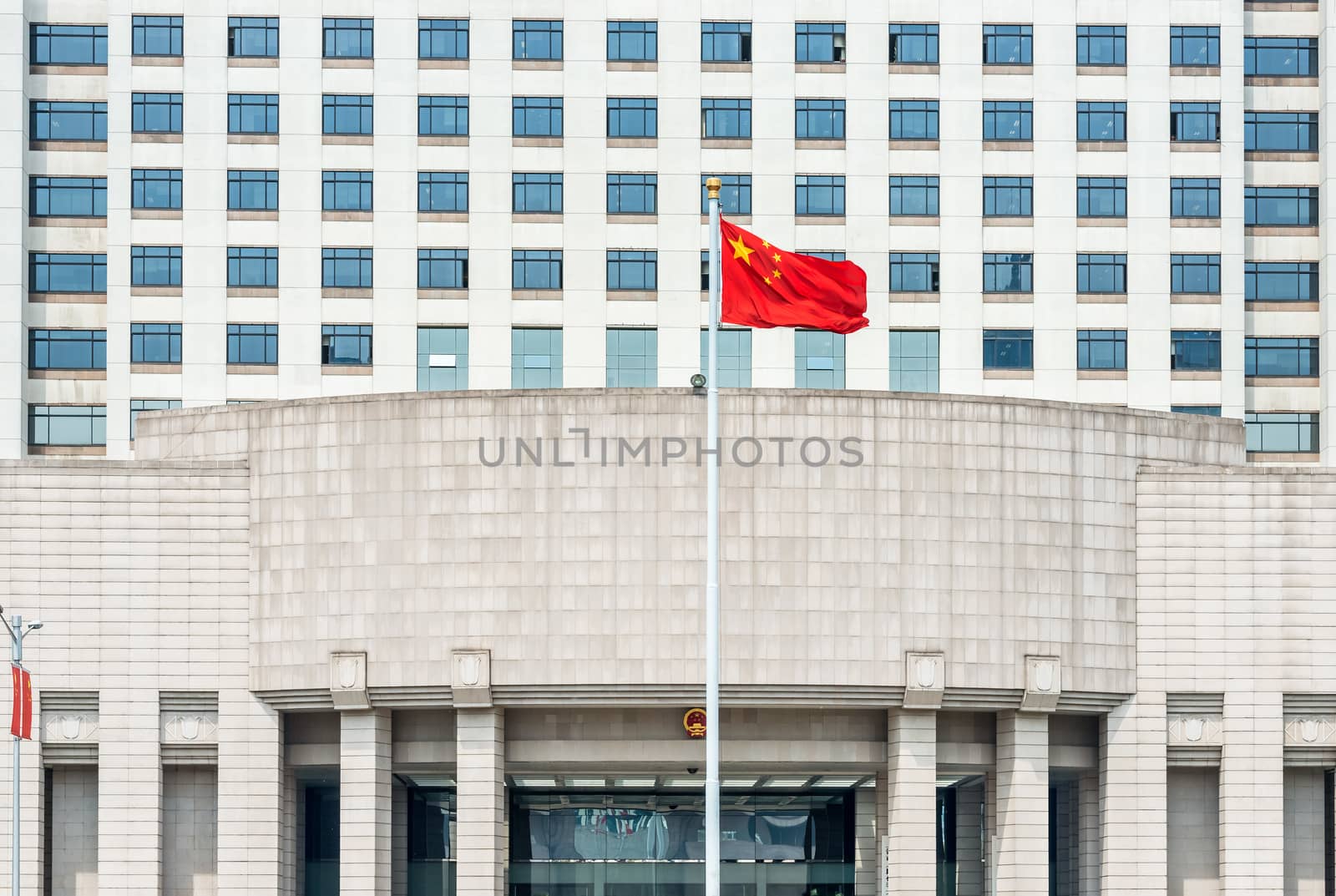 Shanghai, China - April 7, 2013: official chinese military government building on people square shanghai in popular republic of china on april 7th, 2013
