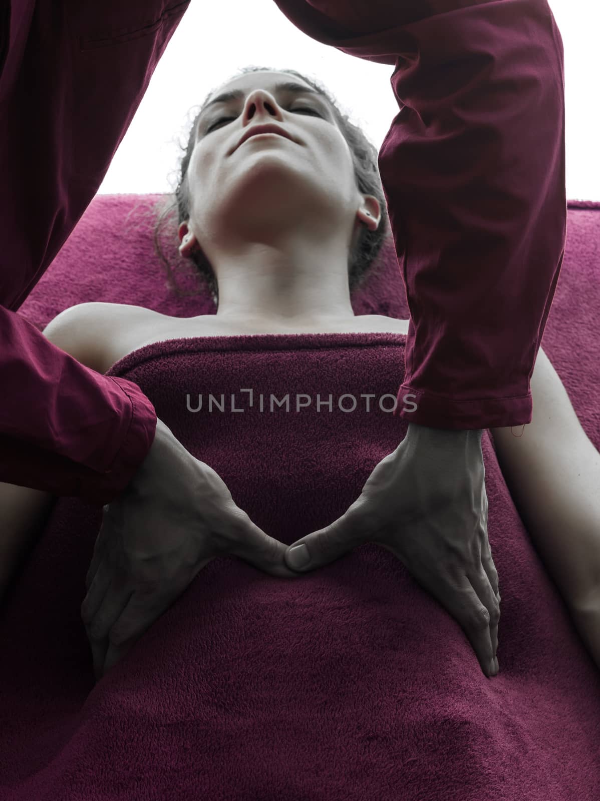 woman receiving belly massage   in silhouette studio on white background