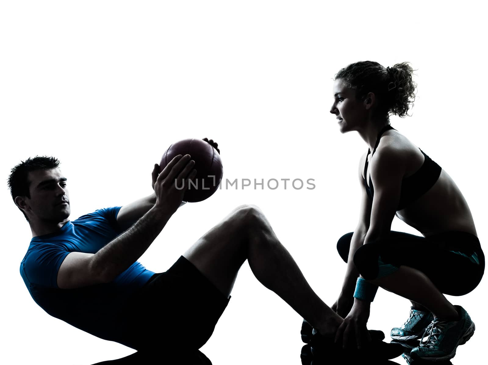 one caucasian couple man woman personal trainer coach exercising weights fitness ball silhouette studio isolated on white background