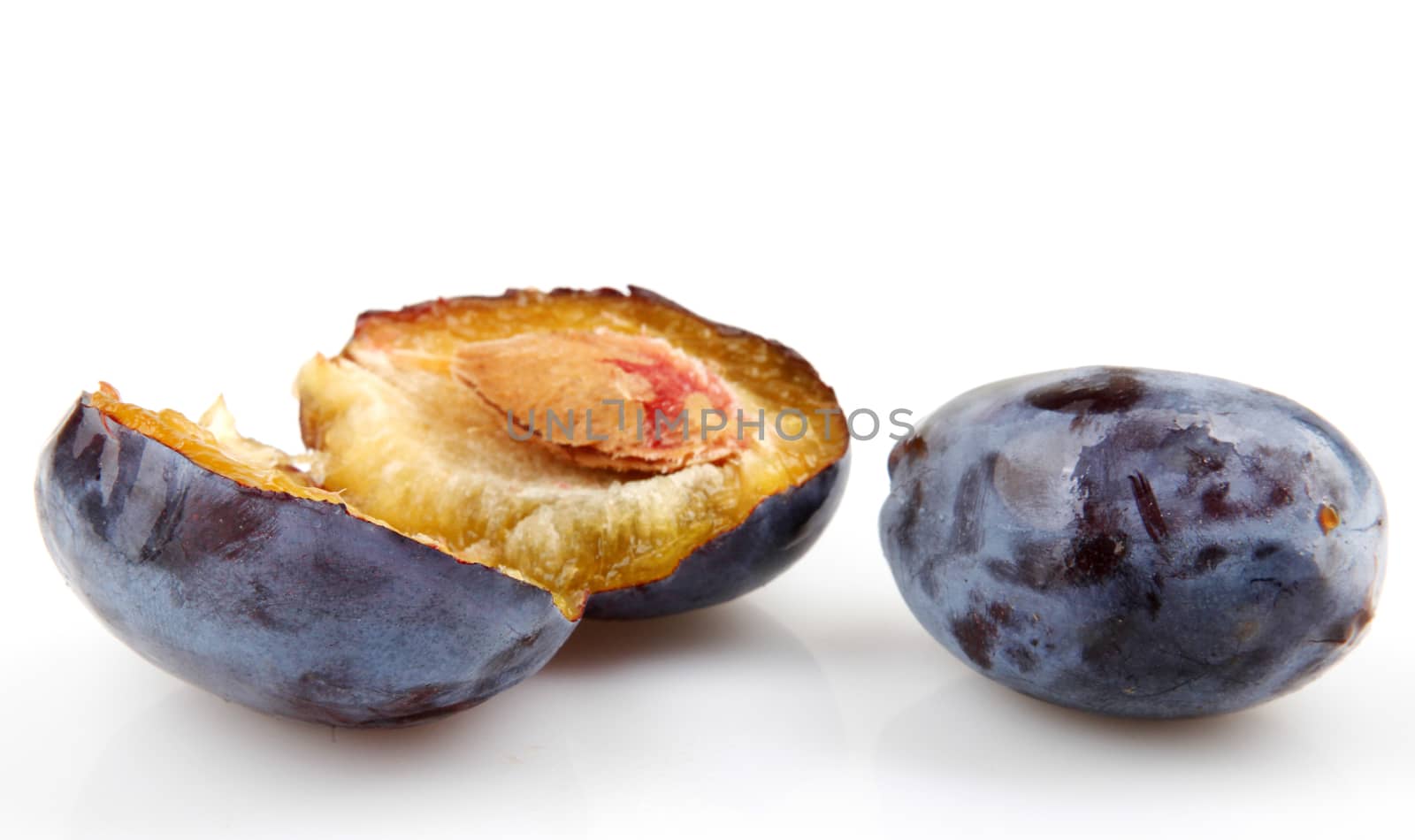 Plums On A White Background