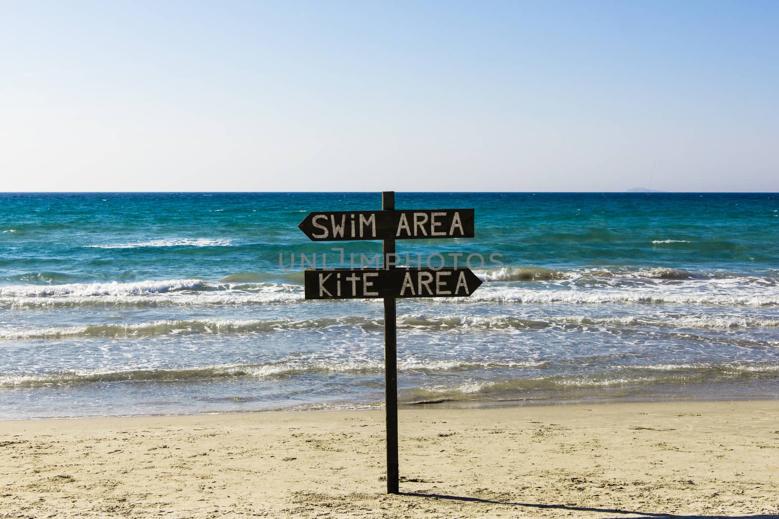 A sign on the beach for kite surfers