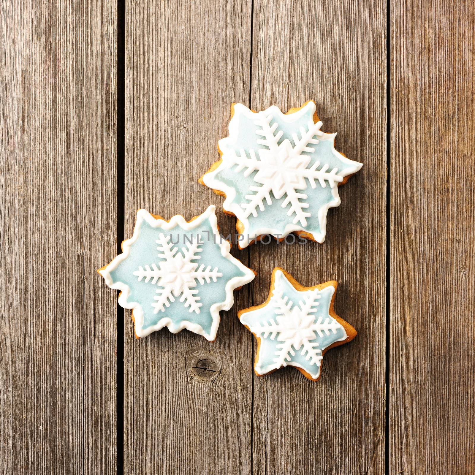 Christmas homemade gingerbread cookie over wooden table