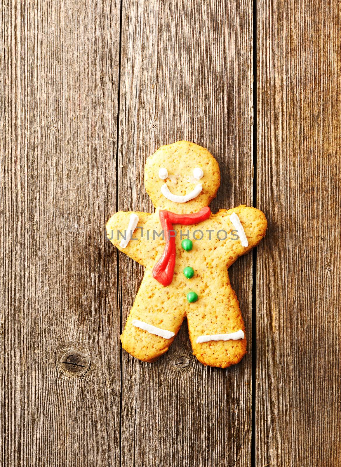 Christmas homemade gingerbread man over wooden table
