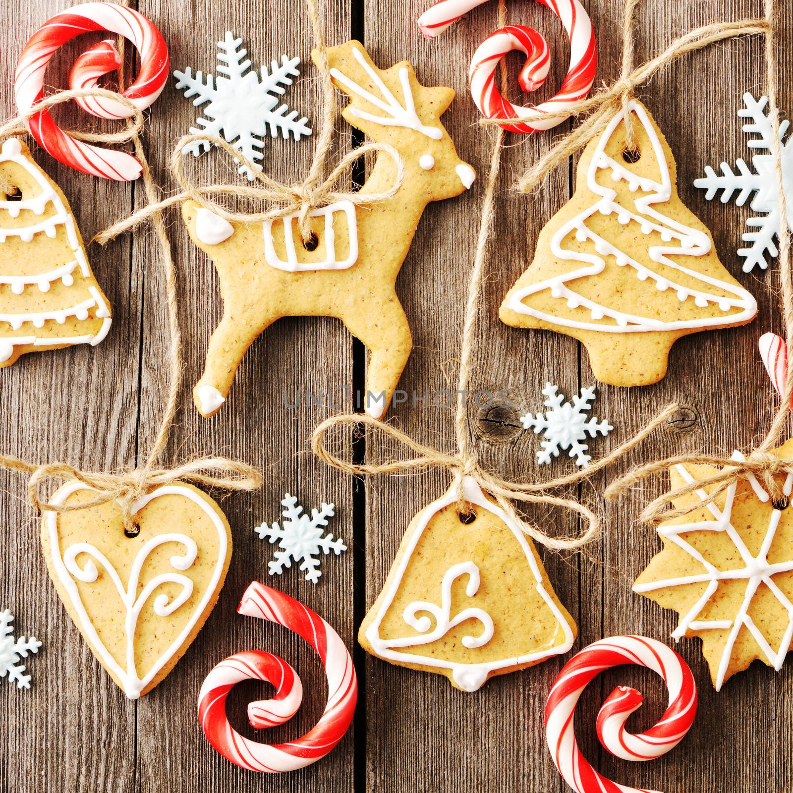 Christmas homemade gingerbread cookies over wooden table