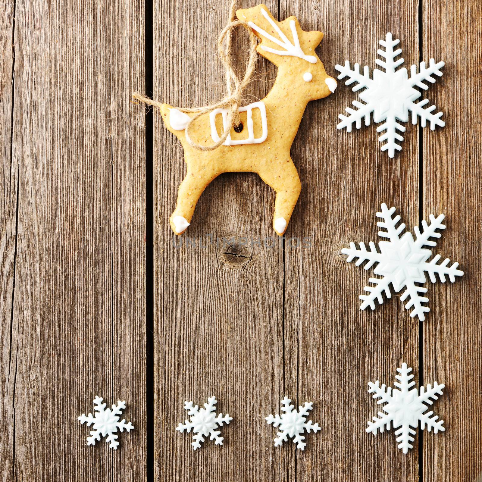 Christmas homemade gingerbread cookies over wooden table