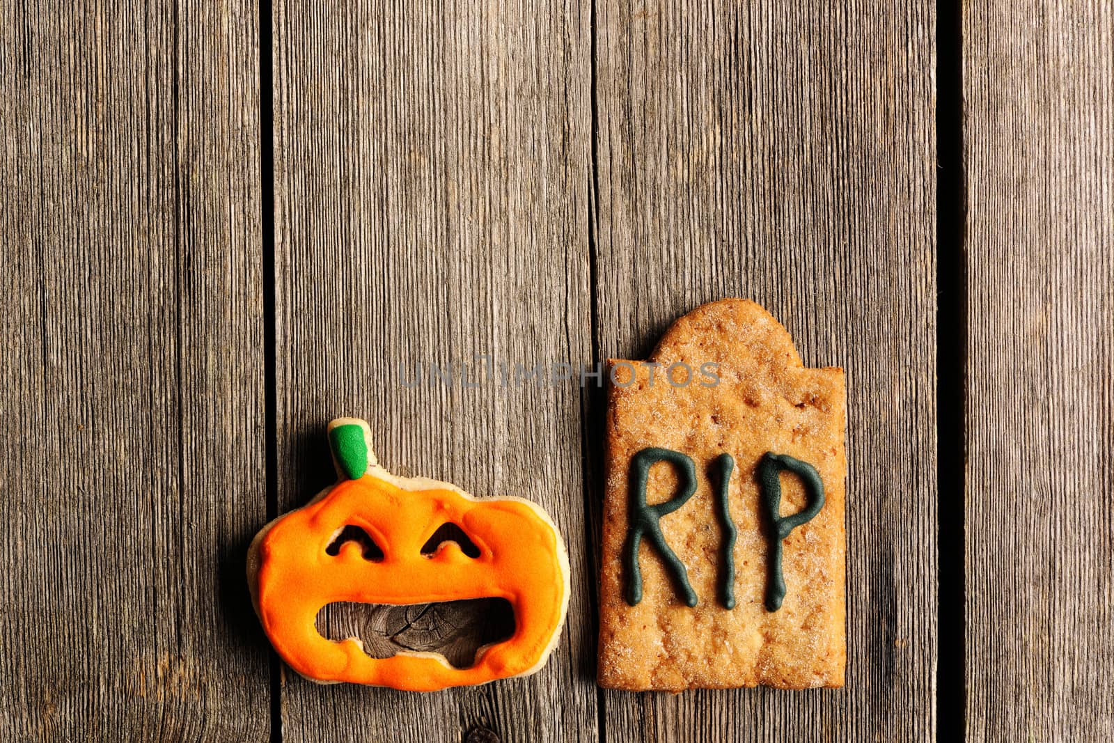 Halloween homemade gingerbread cookies over wooden table