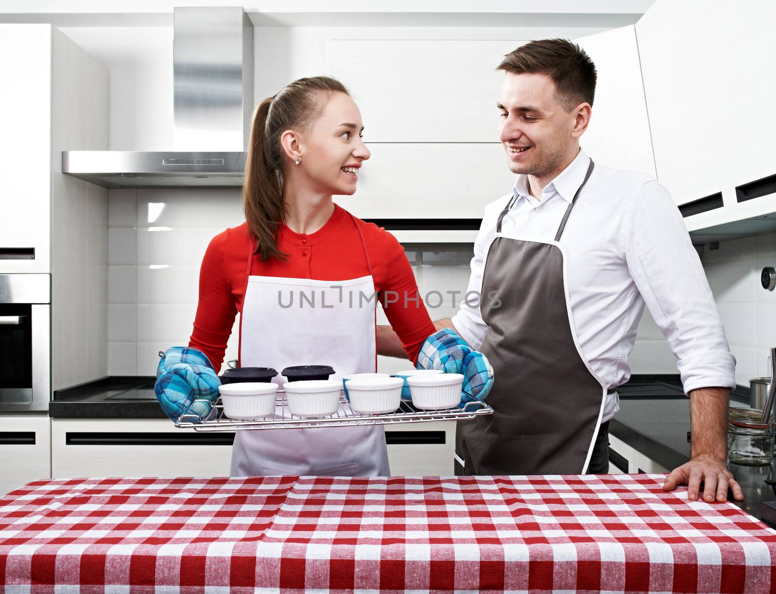 Couple at kitchen cooking together