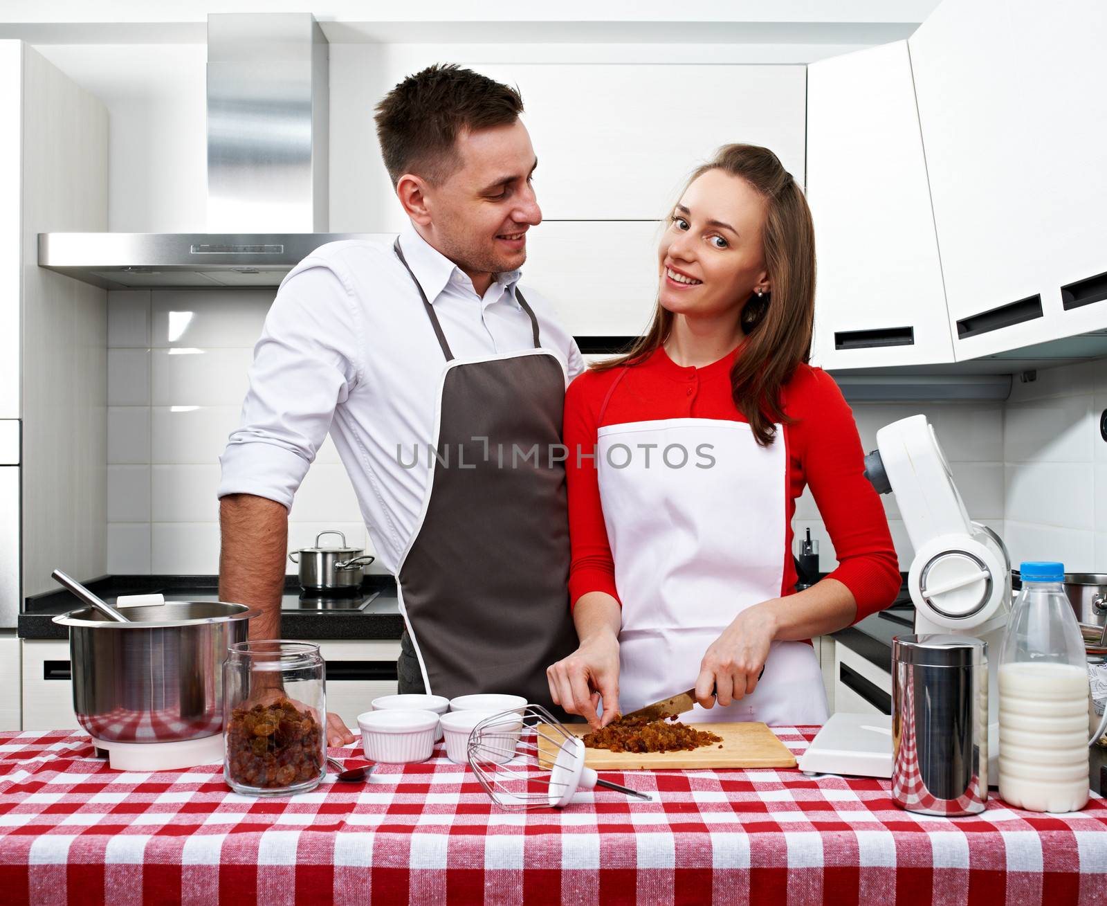 Couple at kitchen cooking together