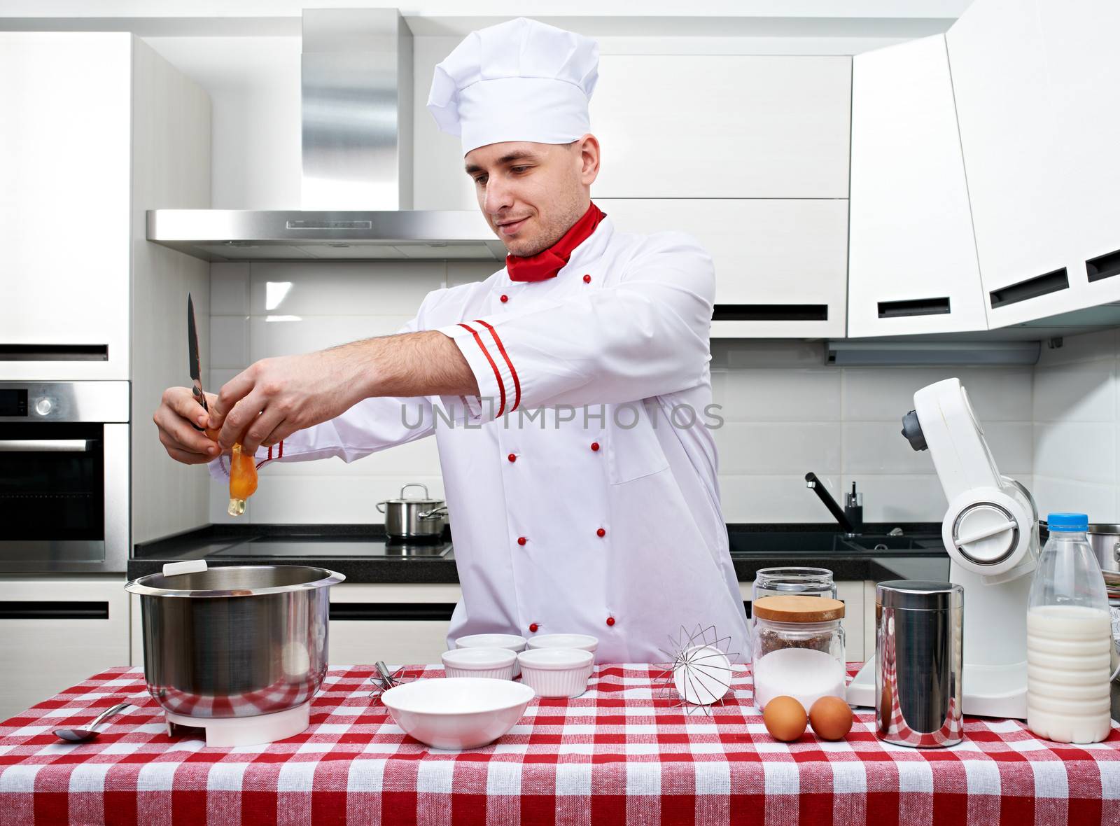 Male chef at kitchen getting ready to cook