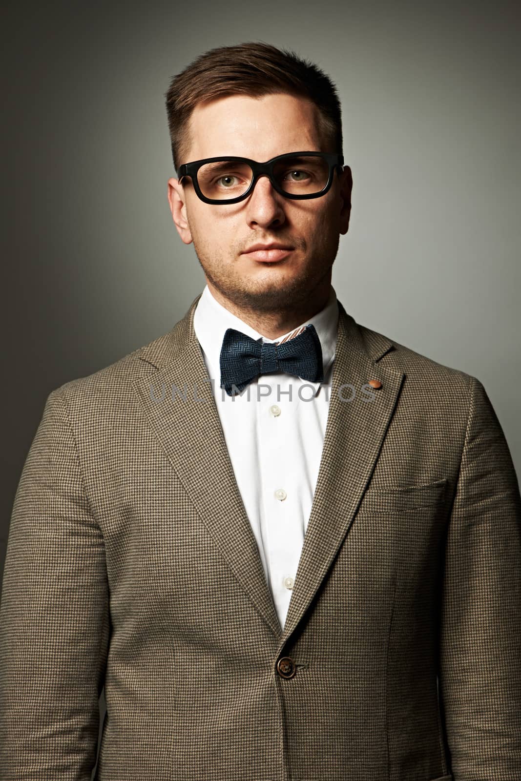 Confident nerd in eyeglasses and bow tie  by haveseen