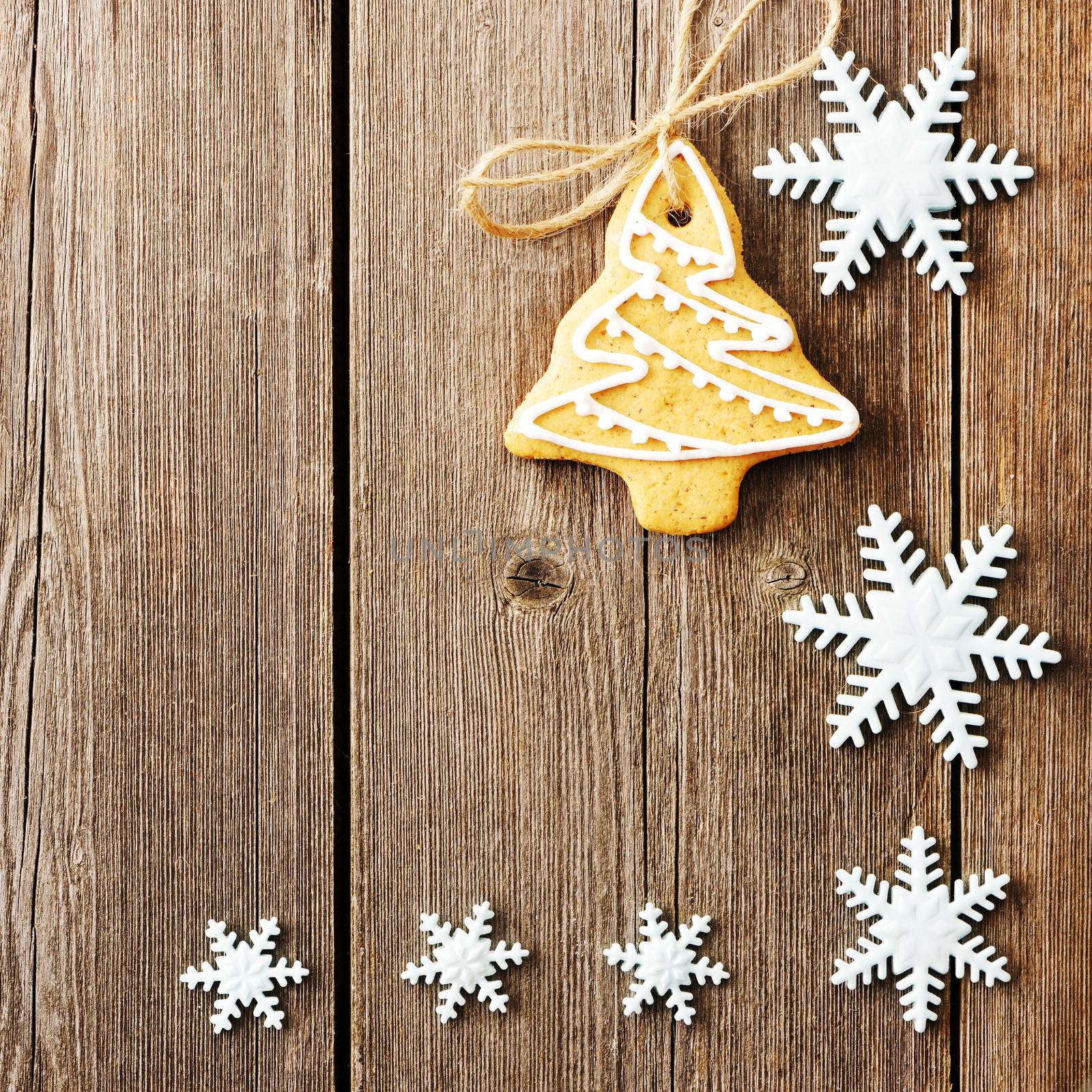 Christmas homemade gingerbread cookies over wooden table