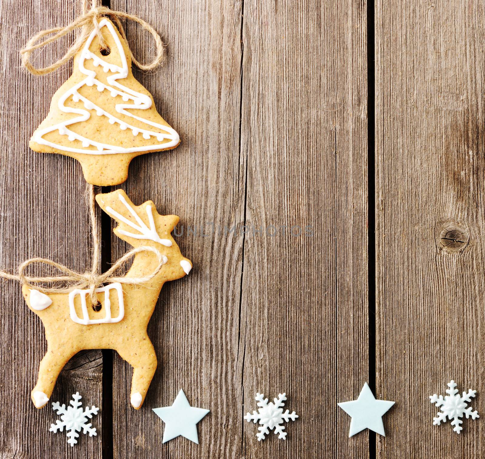 Christmas homemade gingerbread cookies over wooden table