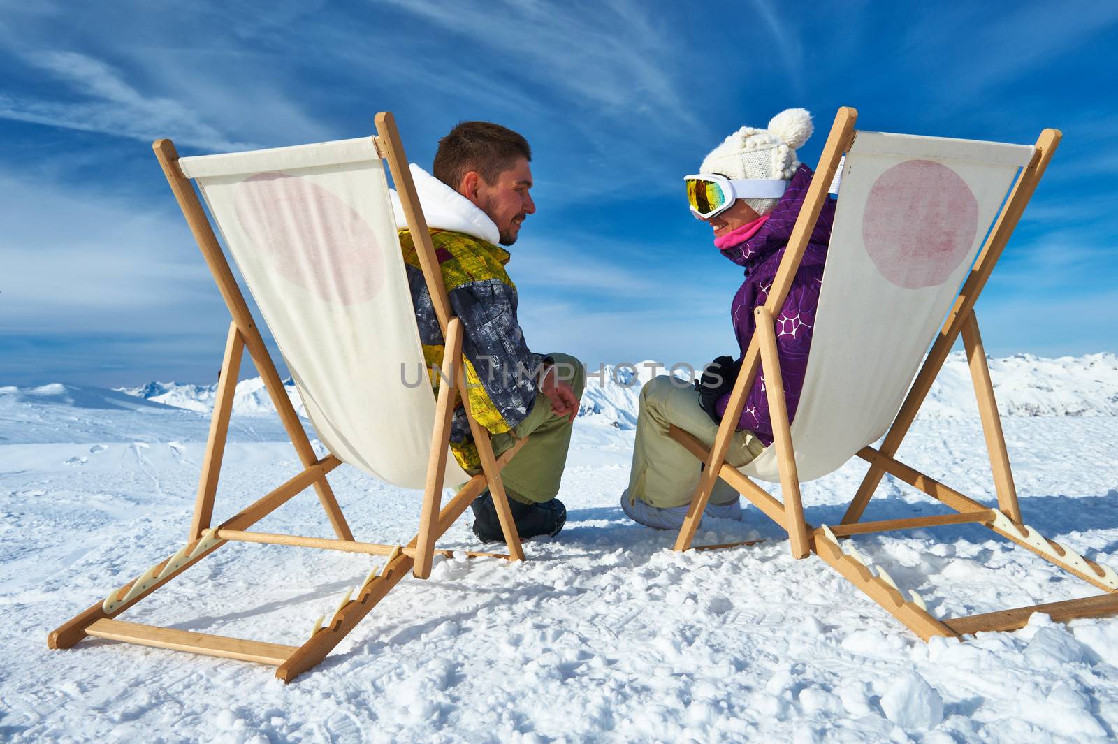 Couple at mountains in winter, Meribel, Alps, France