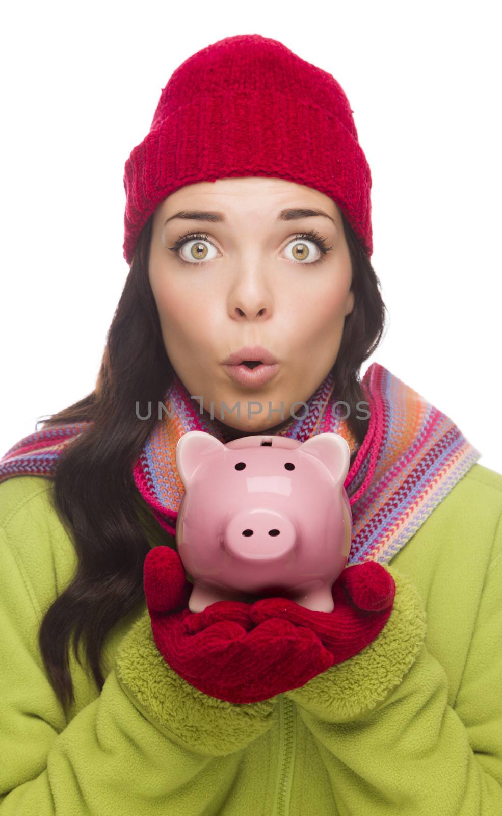 Expressive Mixed Race Woman Wearing Winter Clothing Holding Piggybank Isolated on White Background.