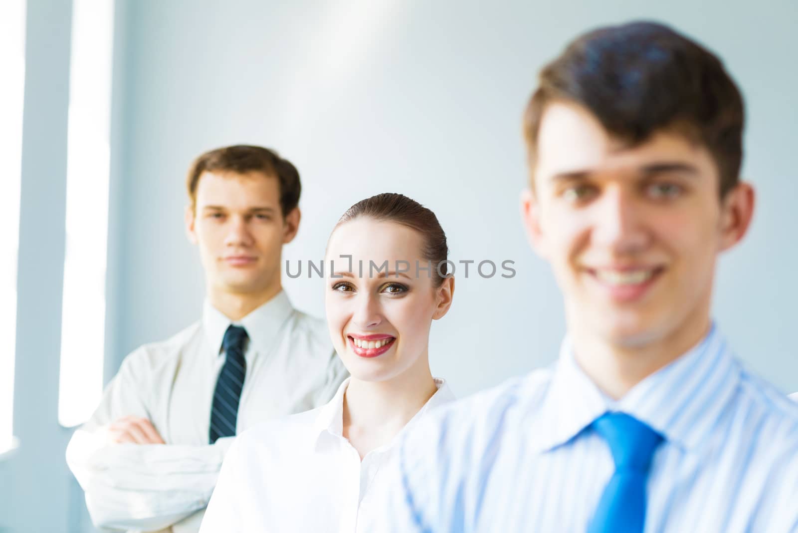 successful businessmen, a portrait of a business woman standing next to colleagues