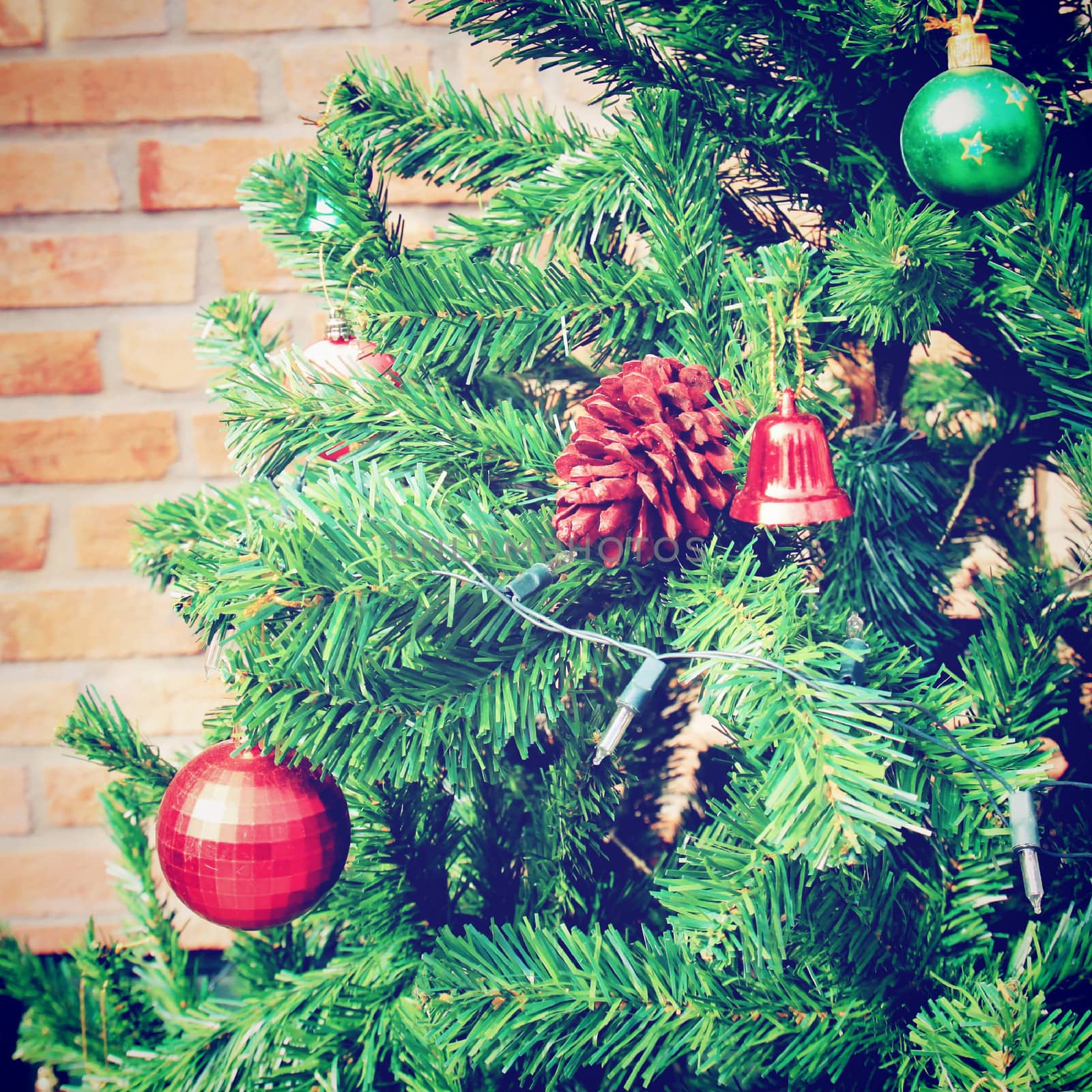 Christmas tree with brick wall, retro filter effect by nuchylee
