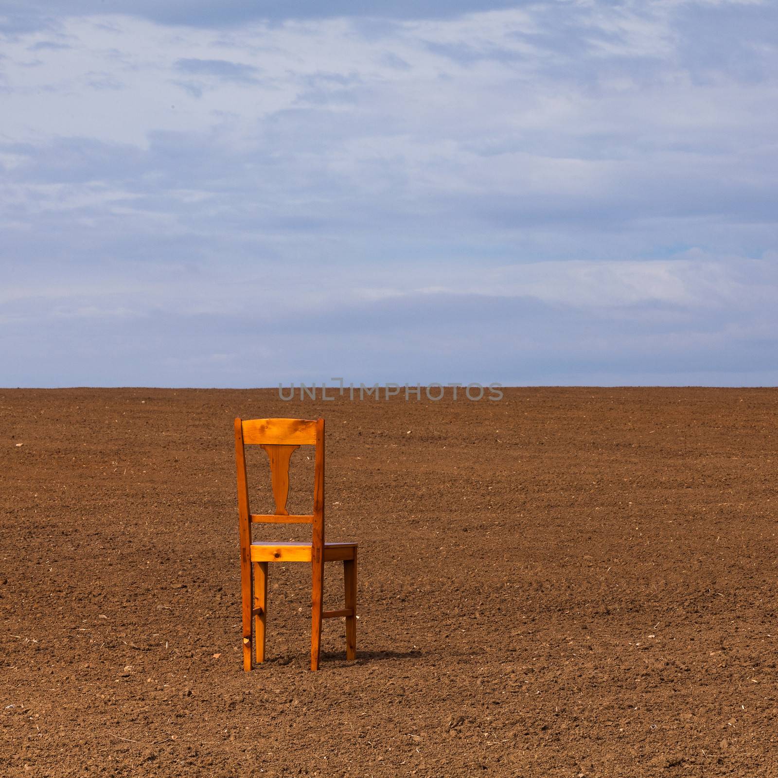 The chair on the field by CaptureLight