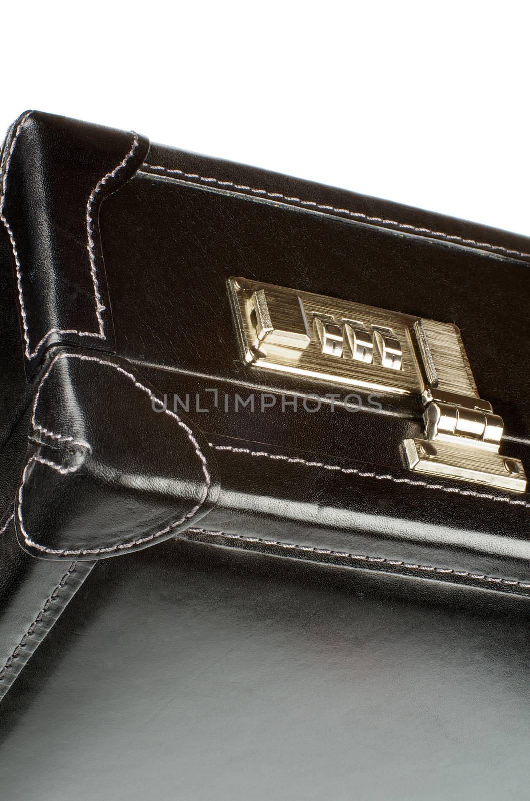 Details of Black Leather Briefcase with Gold Key Lock closeup on white background