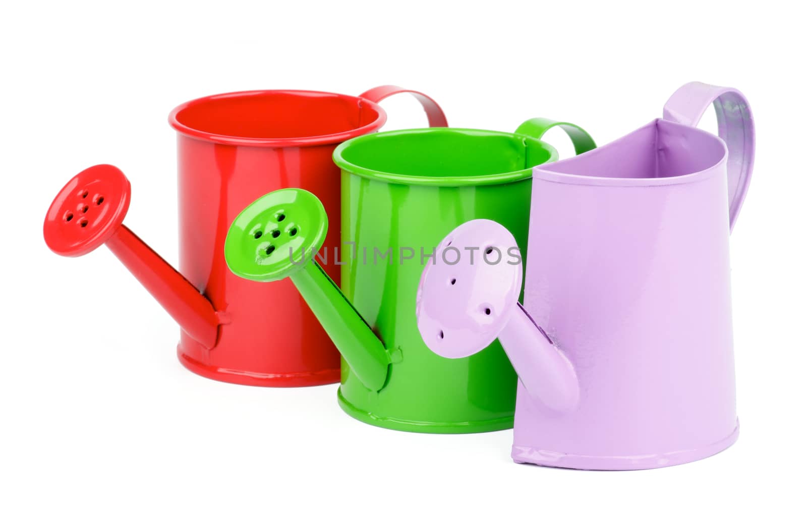 Purple, Green and Red Little Watering-Can In a Row isolated on white background