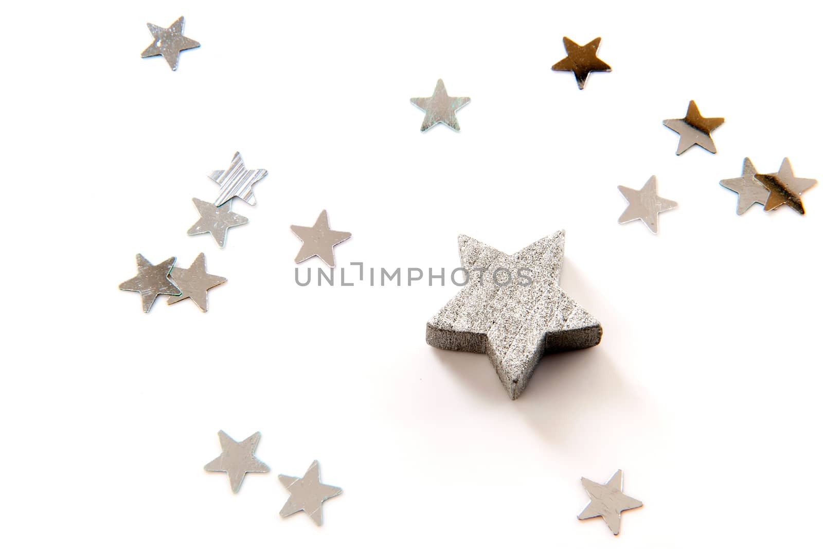 silver stars for christmas on a white background