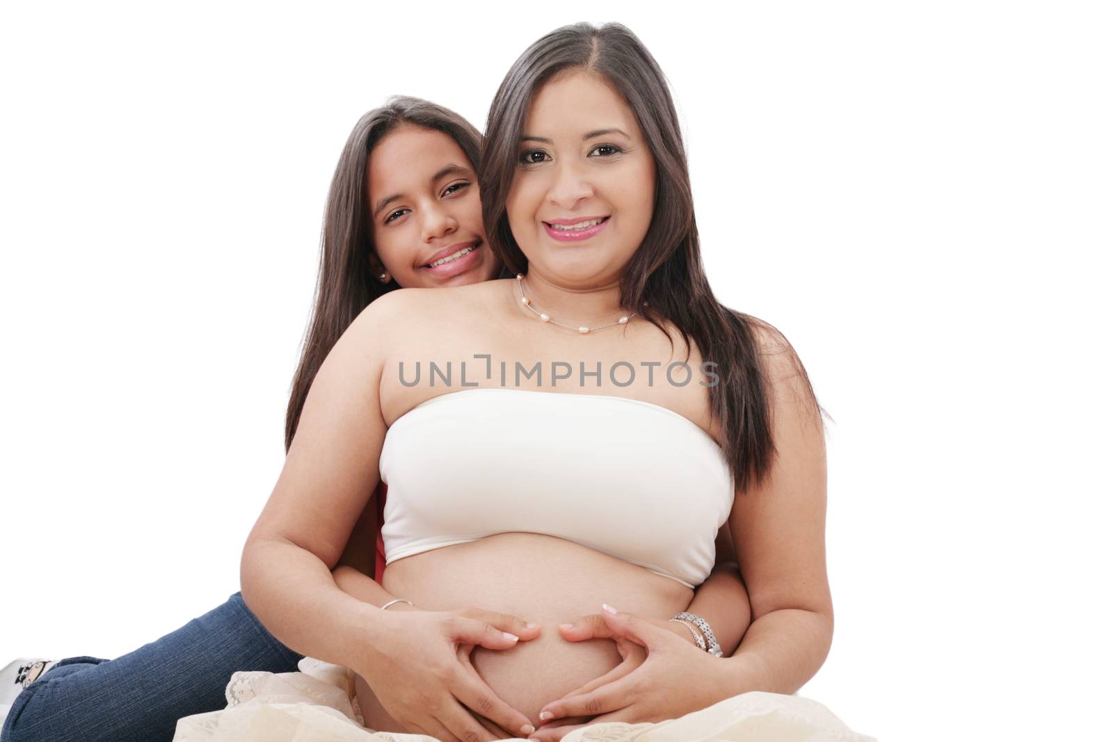 pregnant woman and her daughter making a heart sign by dacasdo