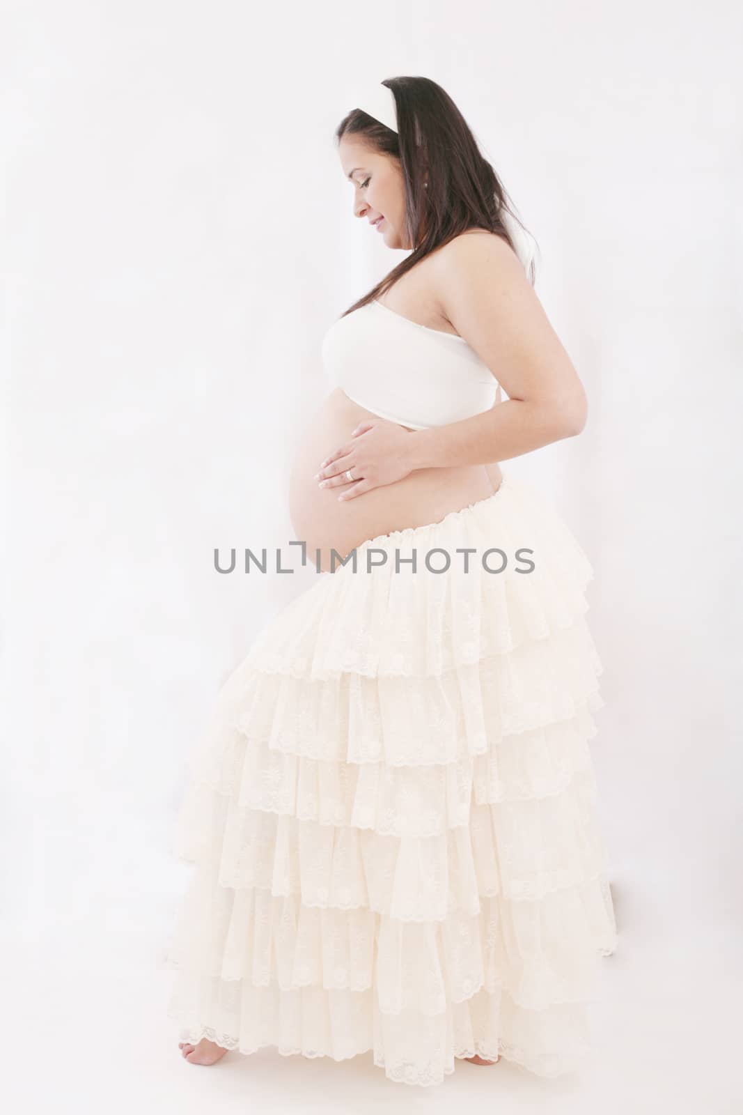 Happy young pregnant woman by dacasdo