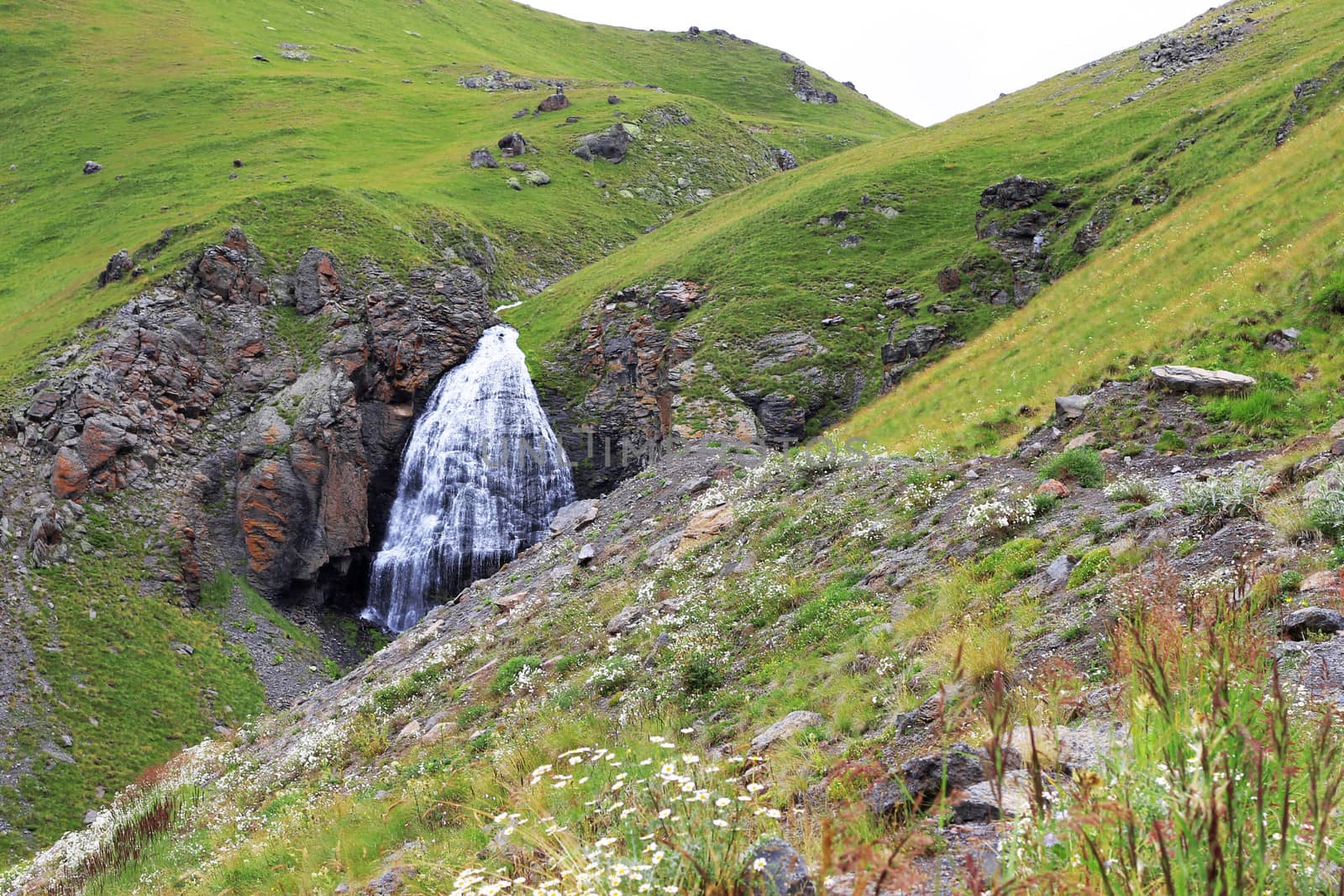 Waterfall Girlish Braids between the mountains of Northern Caucas