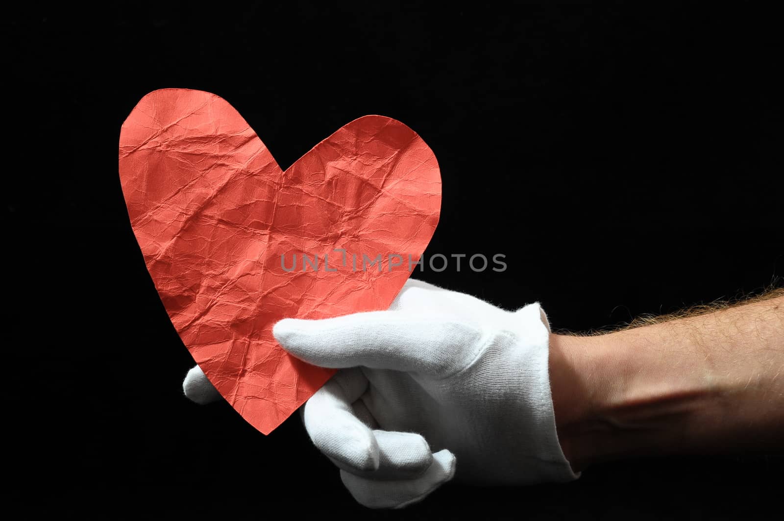 Heart And an Hand on a Black Background