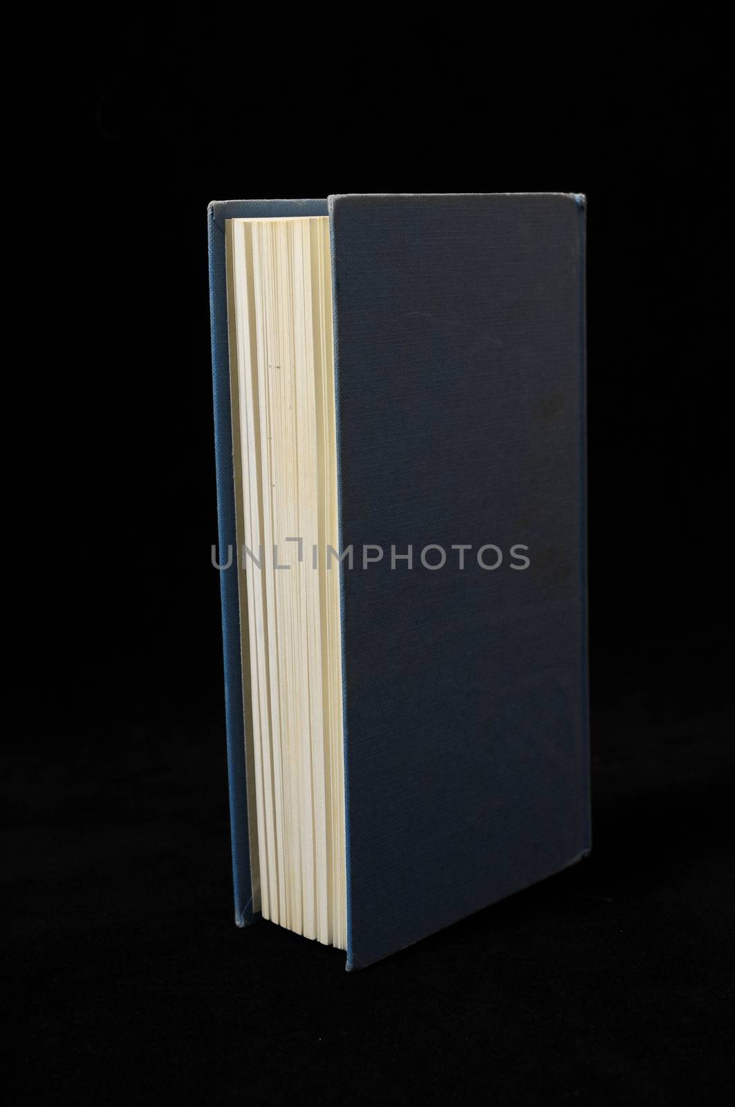 One Empty Book Isolated on a Black Background
