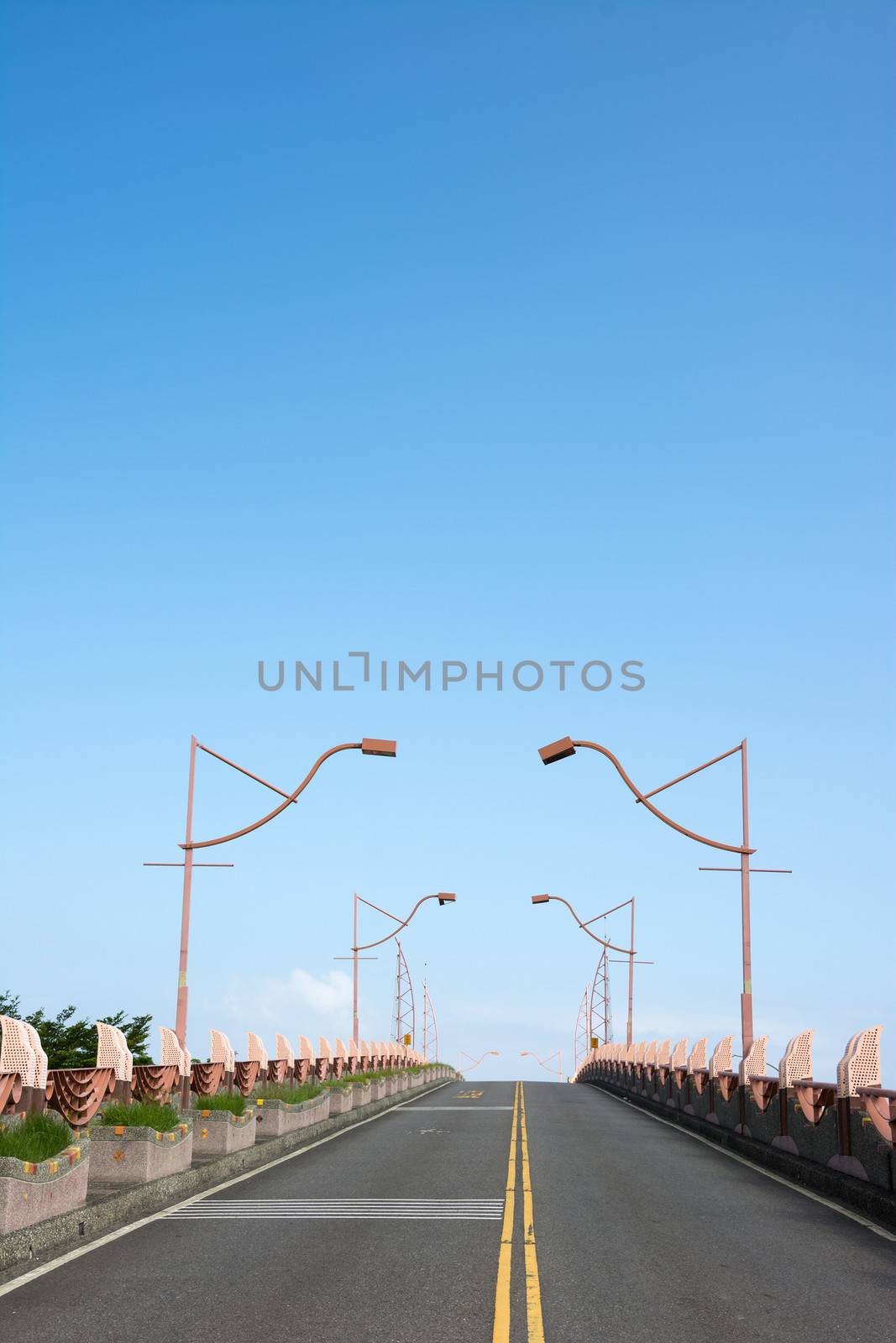 Highway without traffic with a blue clean sky