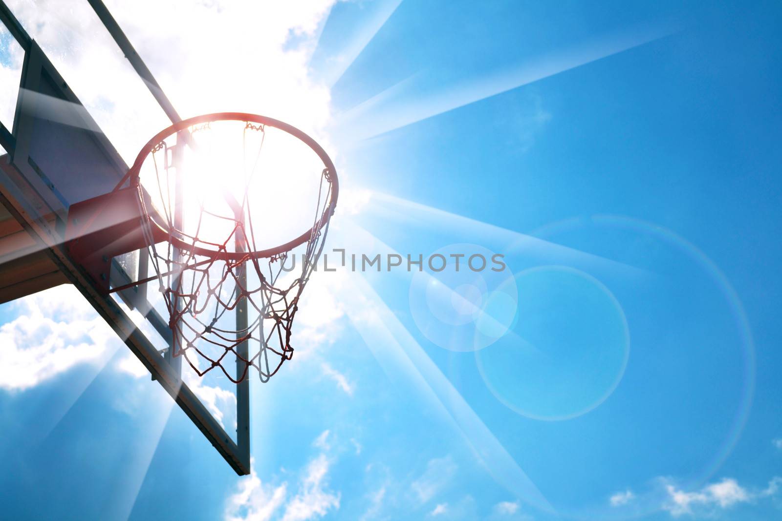 Basketball hoop in the blue sky