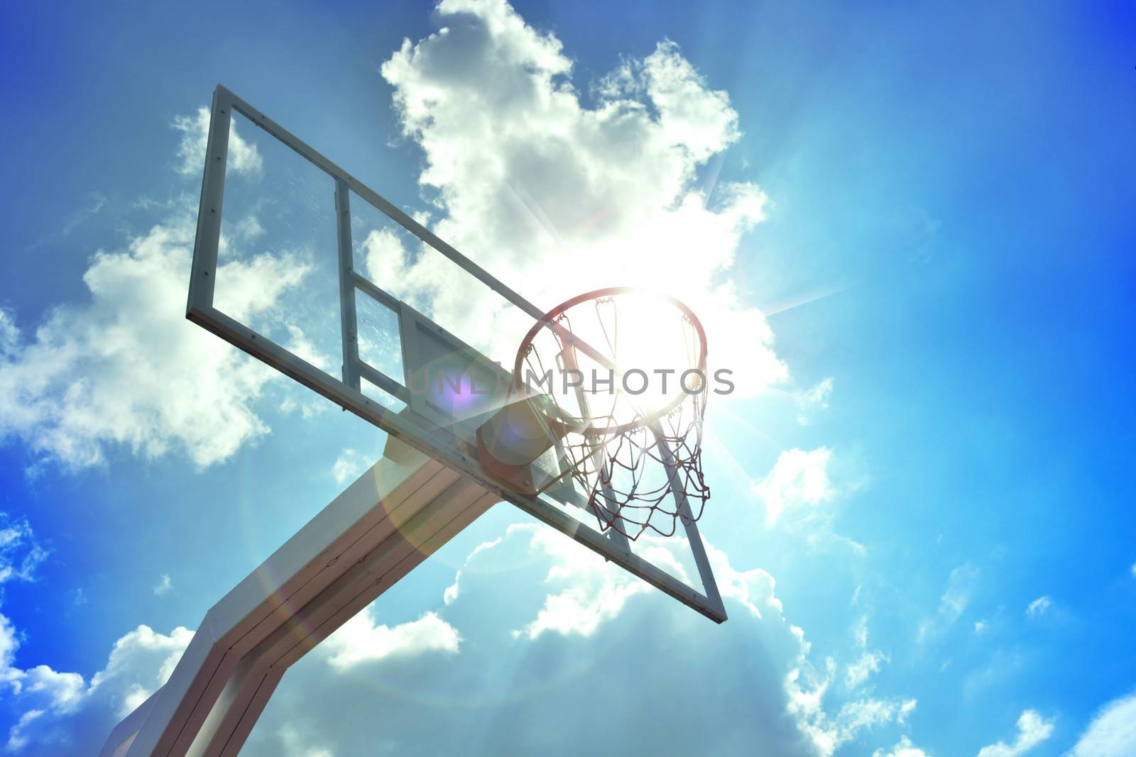 Basketball hoop in the blue sky