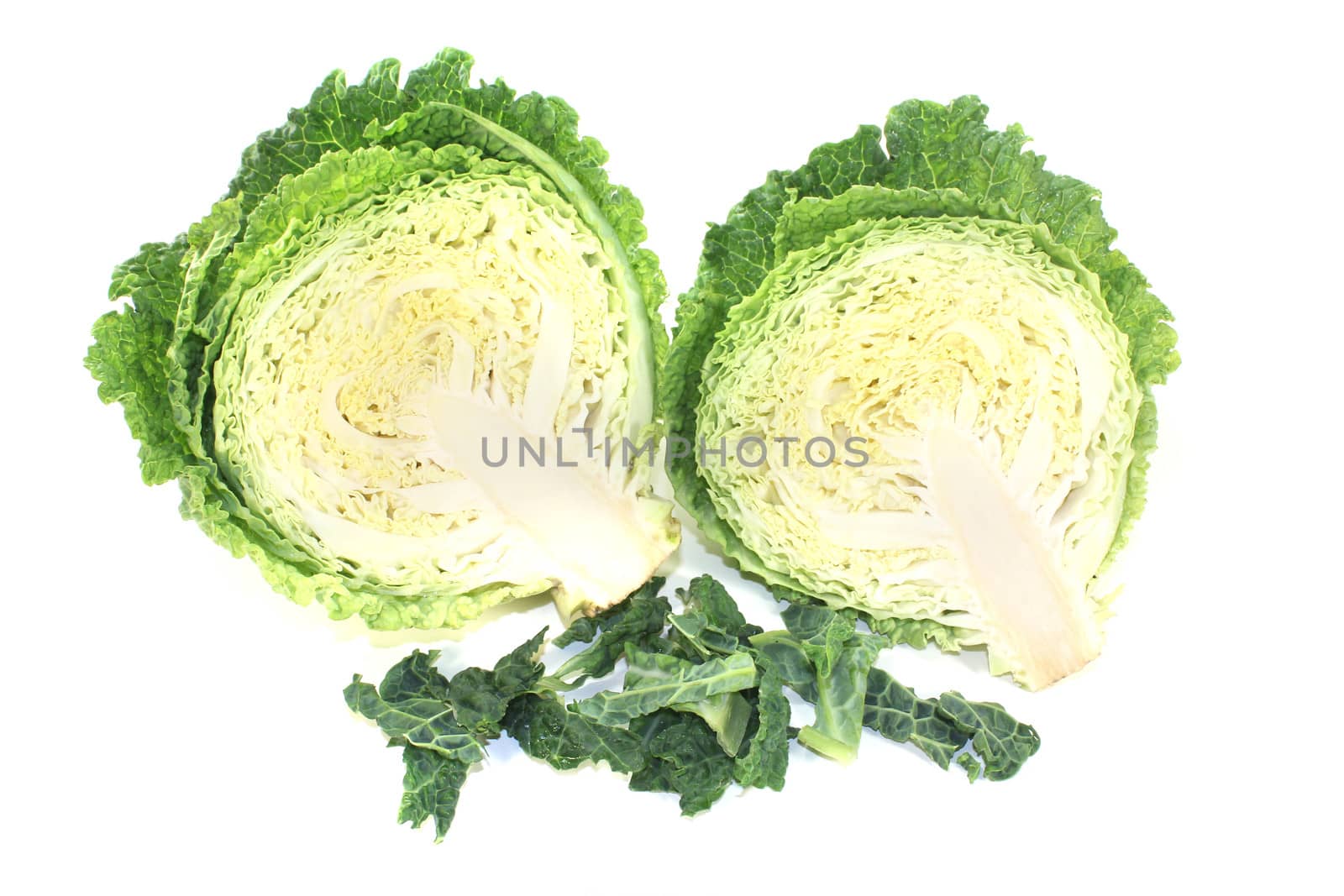 fresh savoy cabbage halves on a bright background