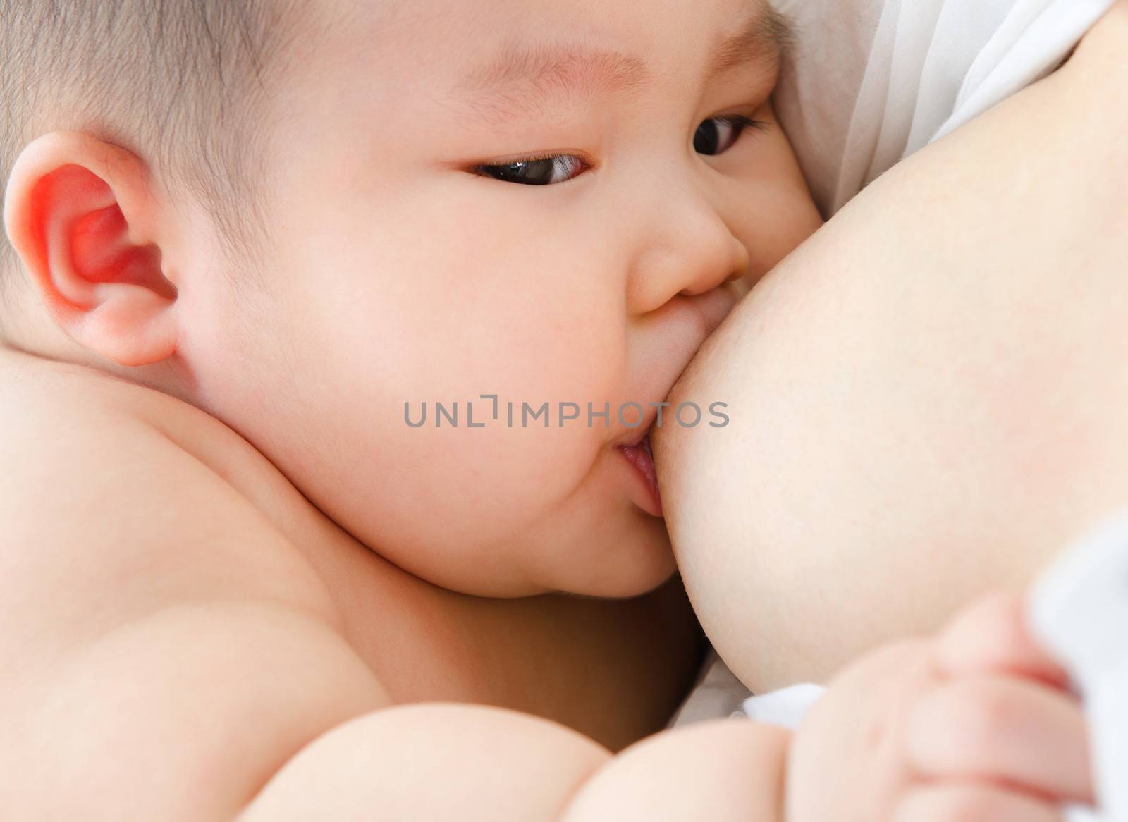 Mother and baby. Close up Asian mother breastfeeding baby boy