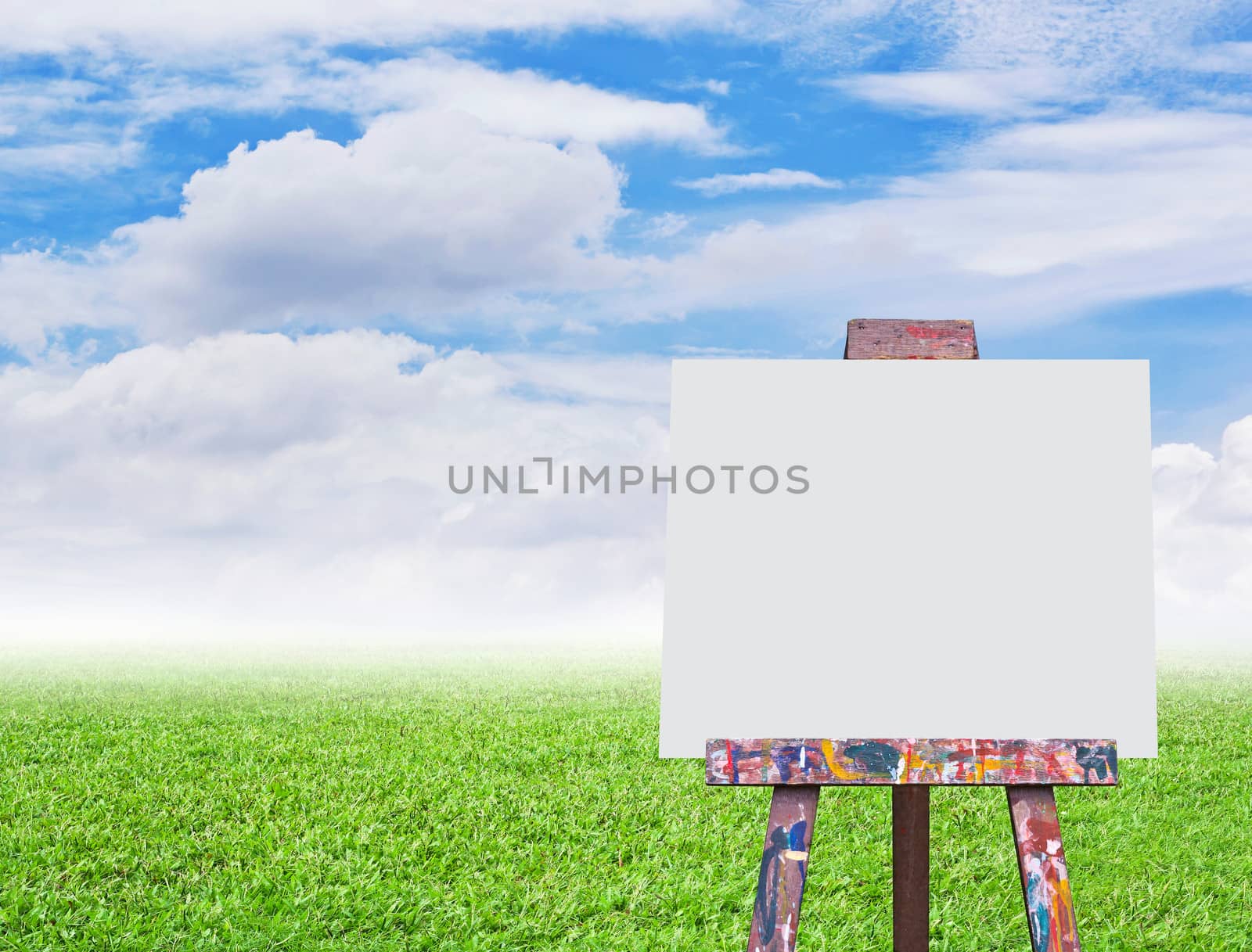 Easel with empty canvas on nature background by Myimagine