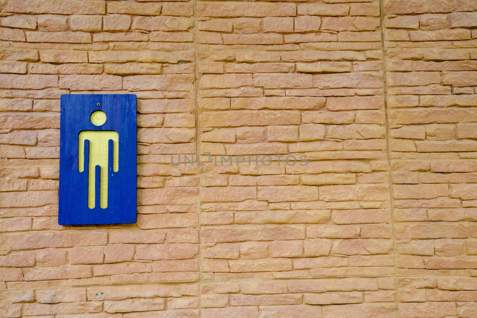 Toilet sign on wall by gjeerawut