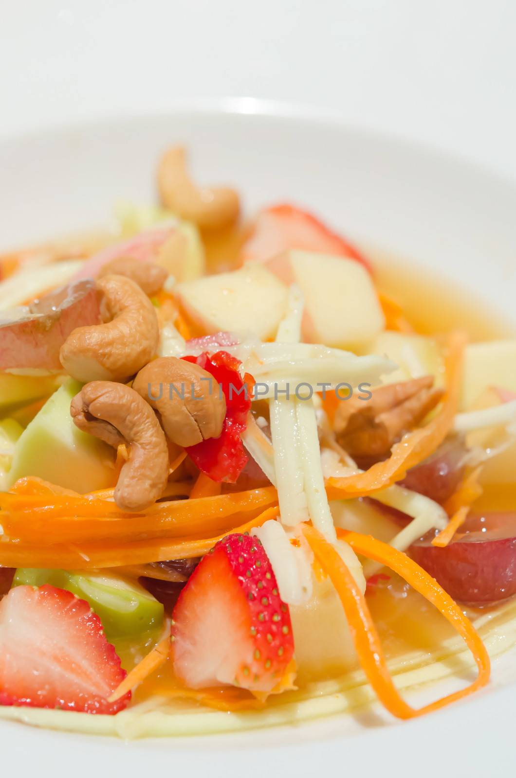 close up spicy  mix  fruits salad with chili sauce