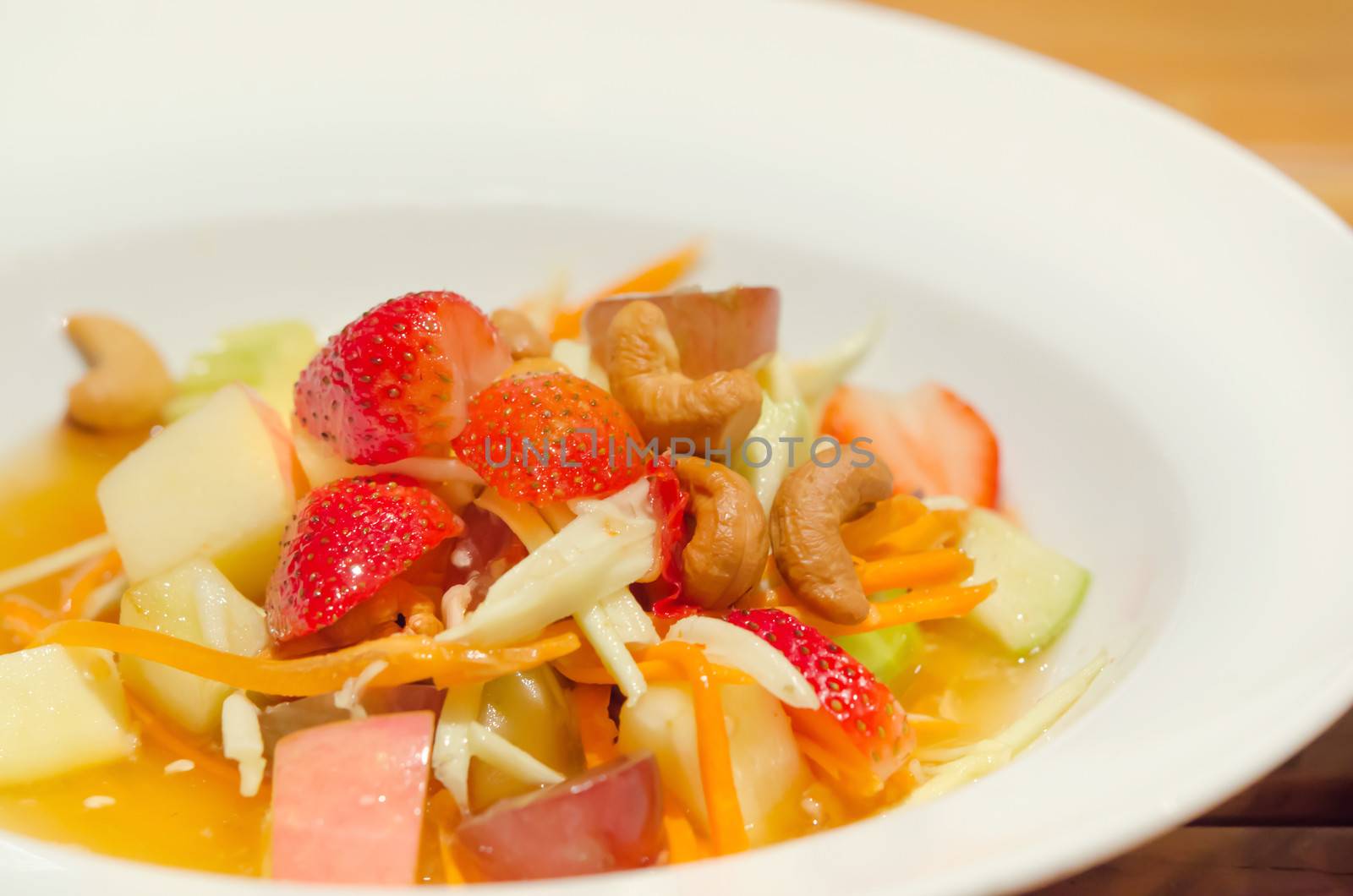 spicy mix  fruits salad , asian style  cuisine on white dish