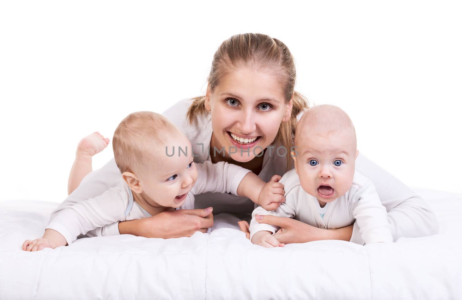 Smiling young woman with two baby boys over white