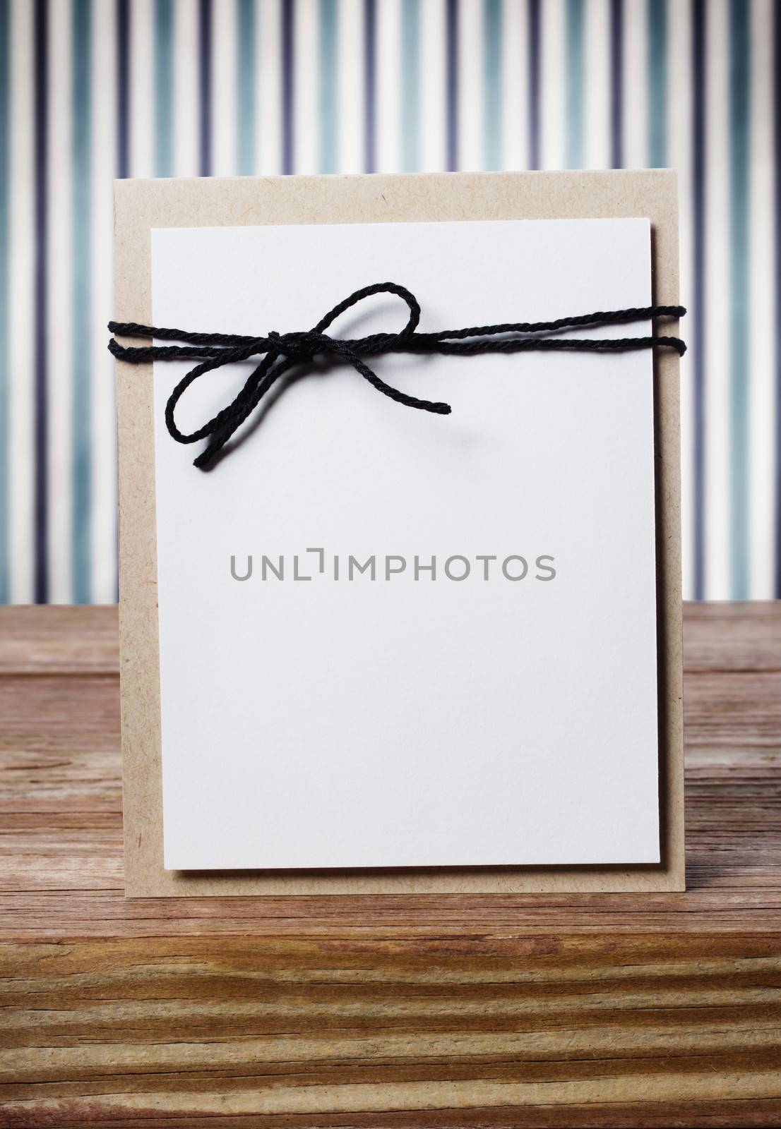 Hand crafted blank card on a striped background by melpomene