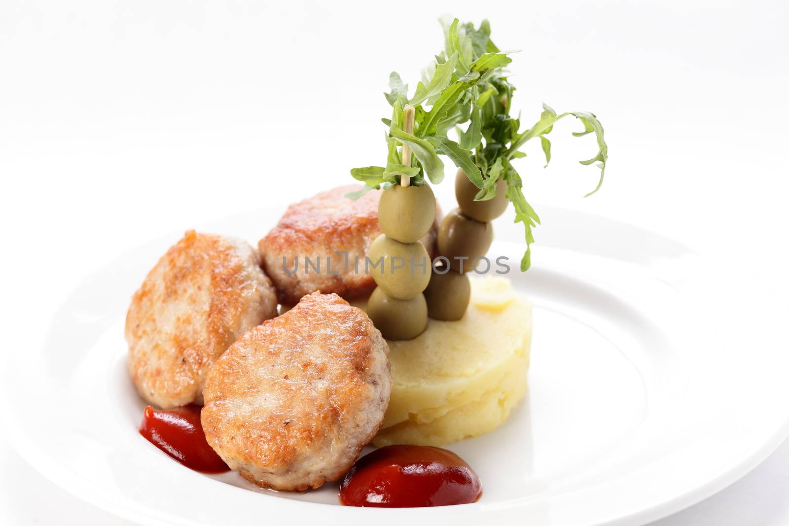 cold cutlets with garnish on white background