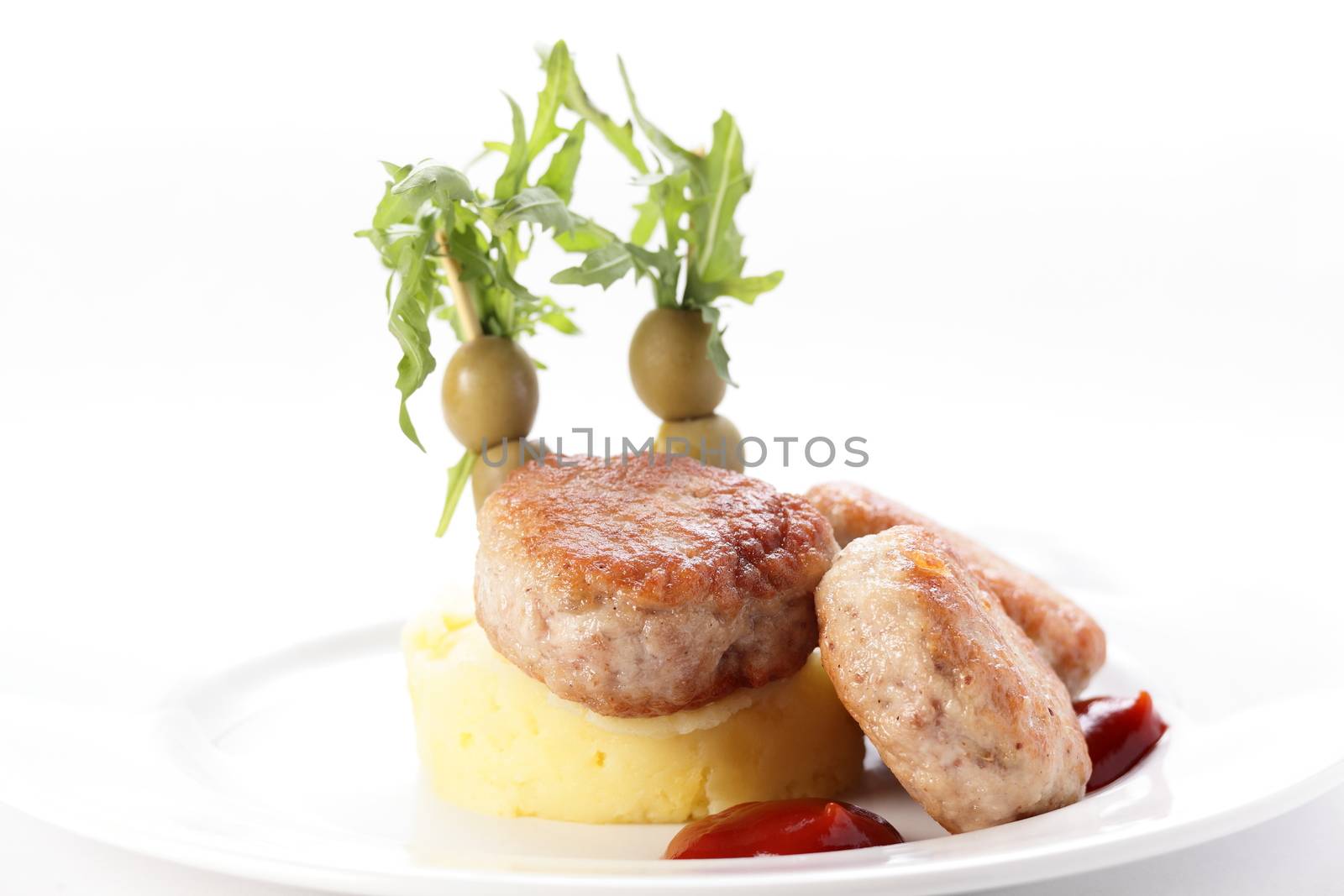 cold cutlets with garnish on white background