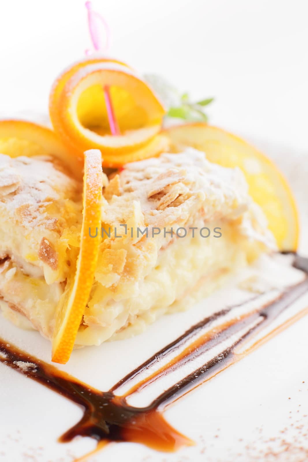 fresh and tasty cake on white dish and white background