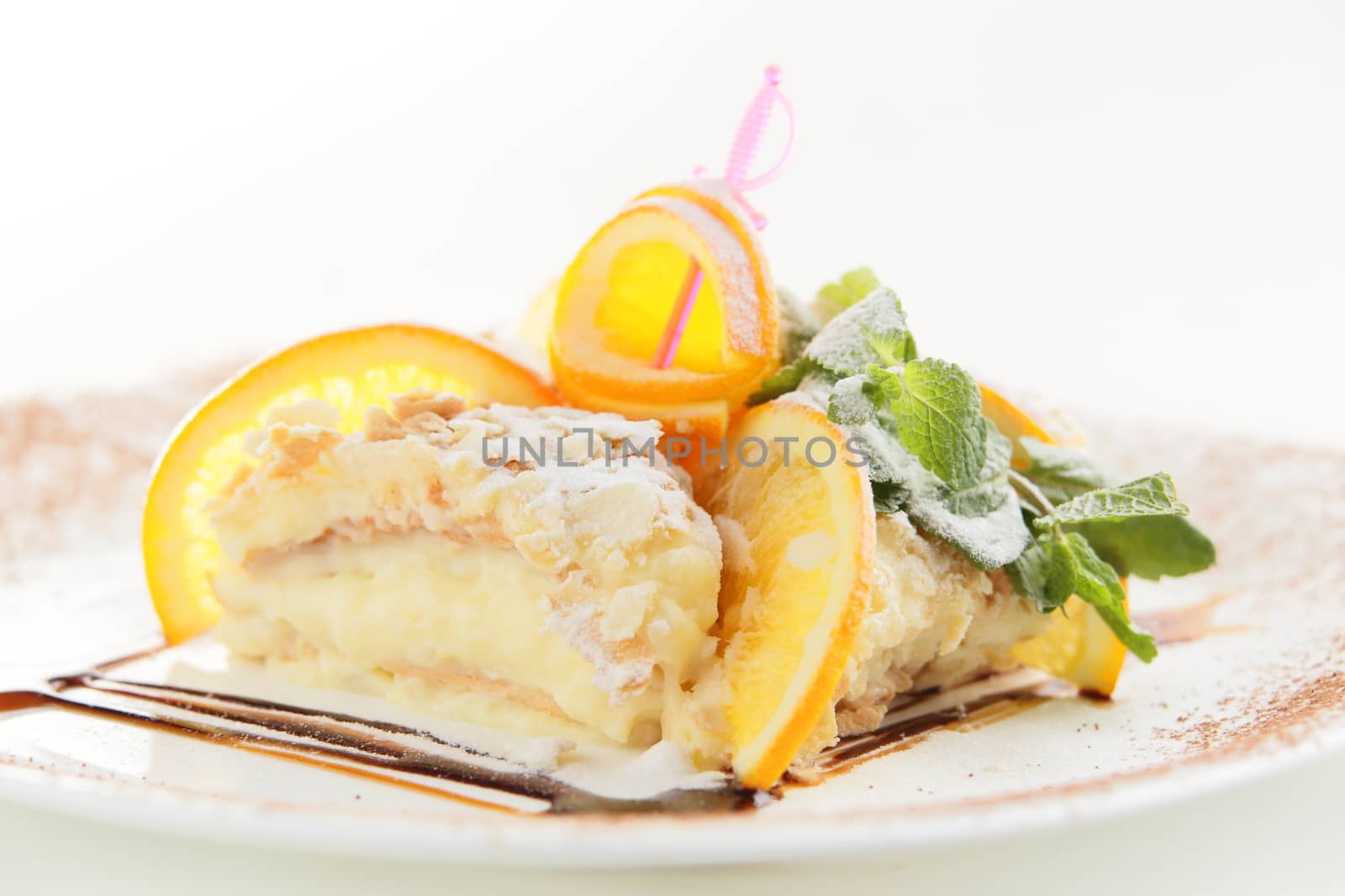 fresh and tasty cake on white dish and white background