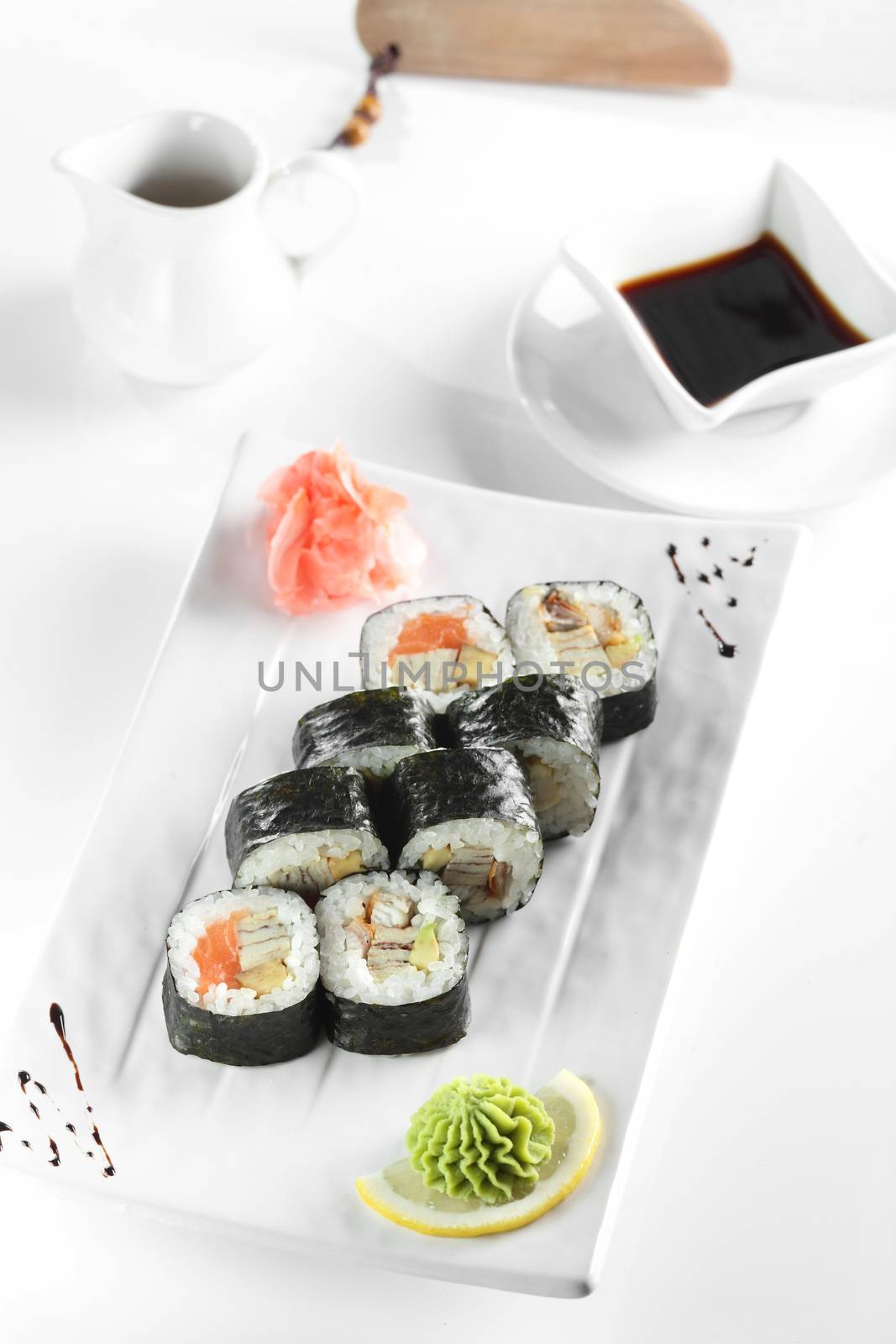 fresh and tasty sushi on bright background