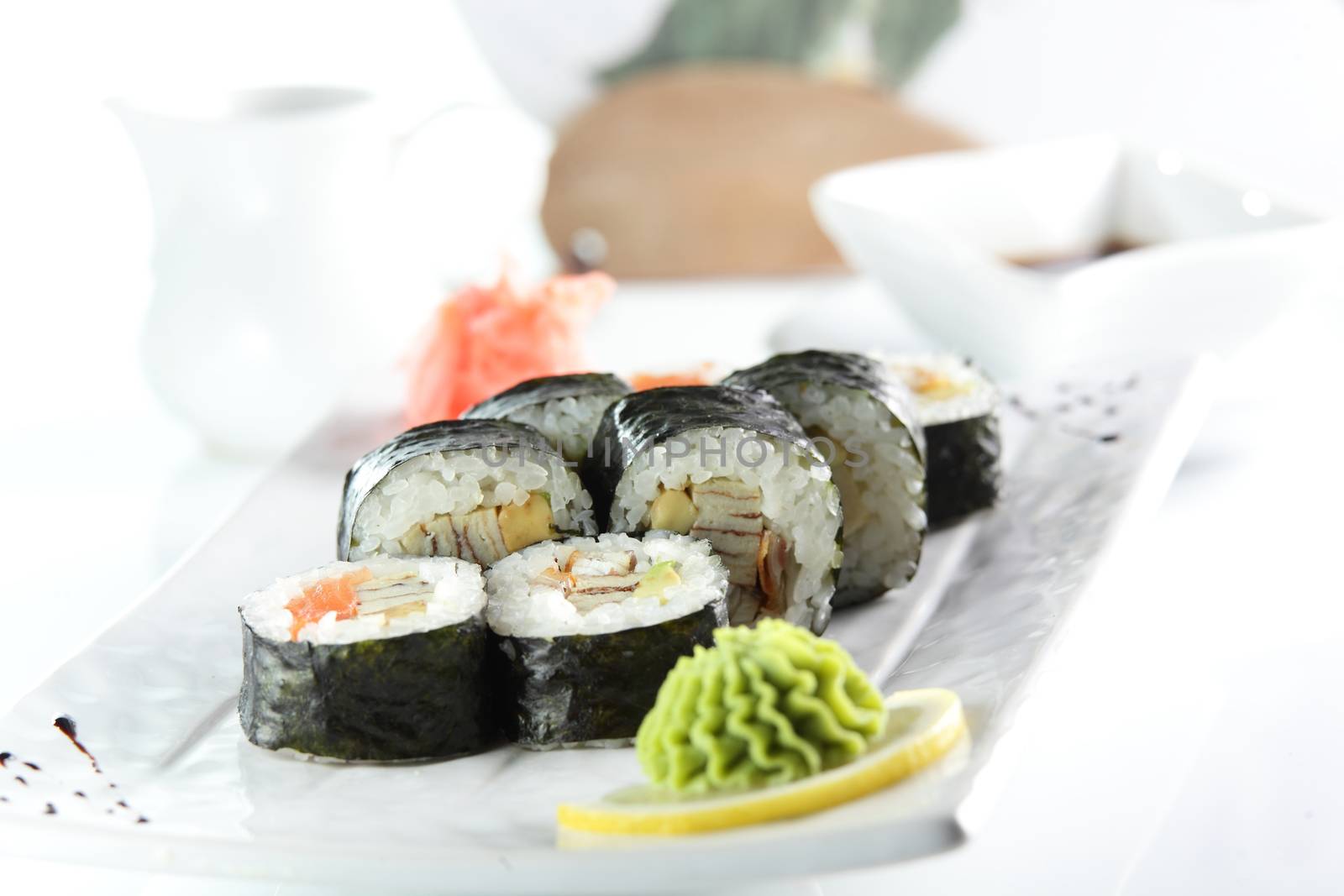 fresh and tasty sushi on bright background