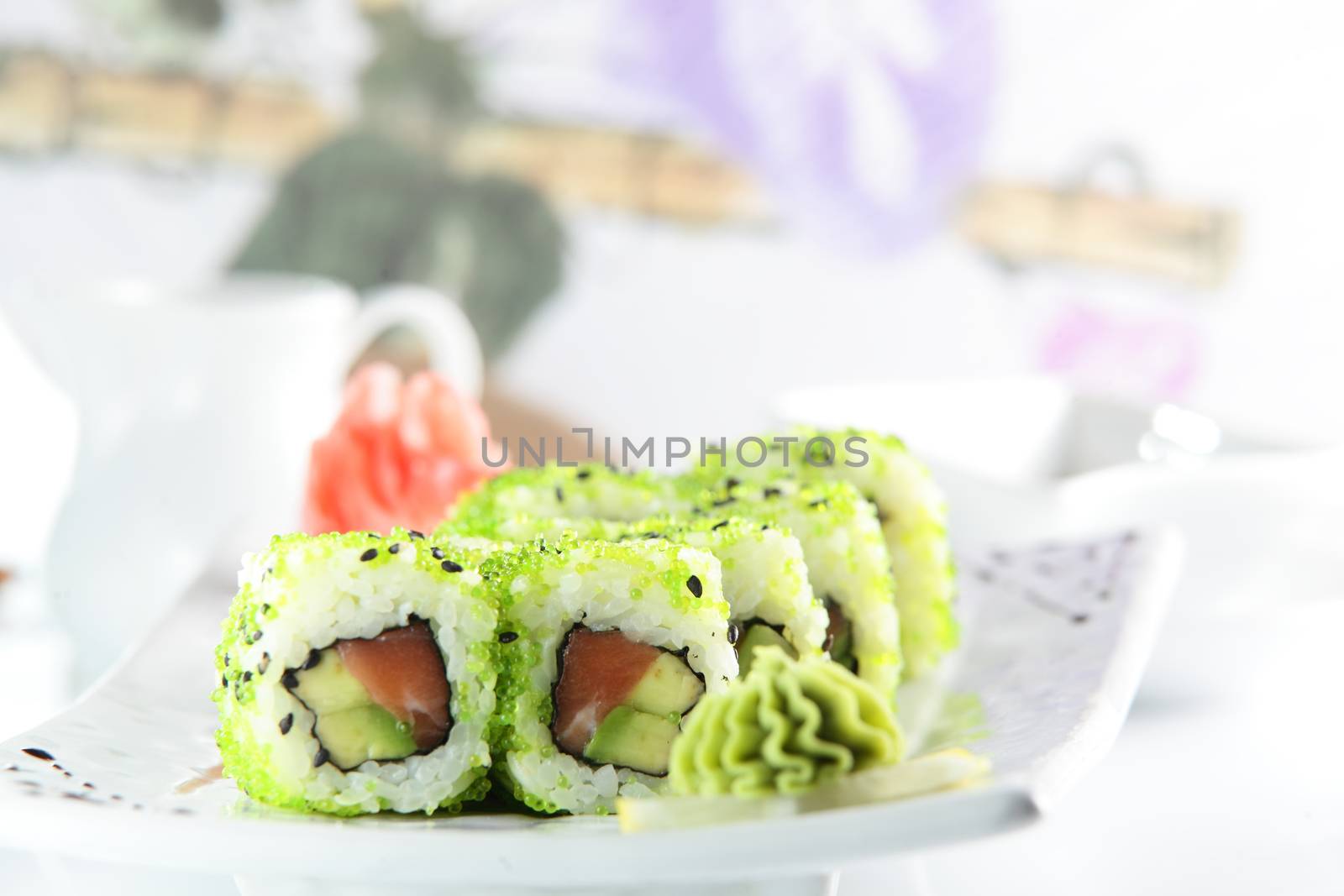 fresh and tasty sushi on bright background