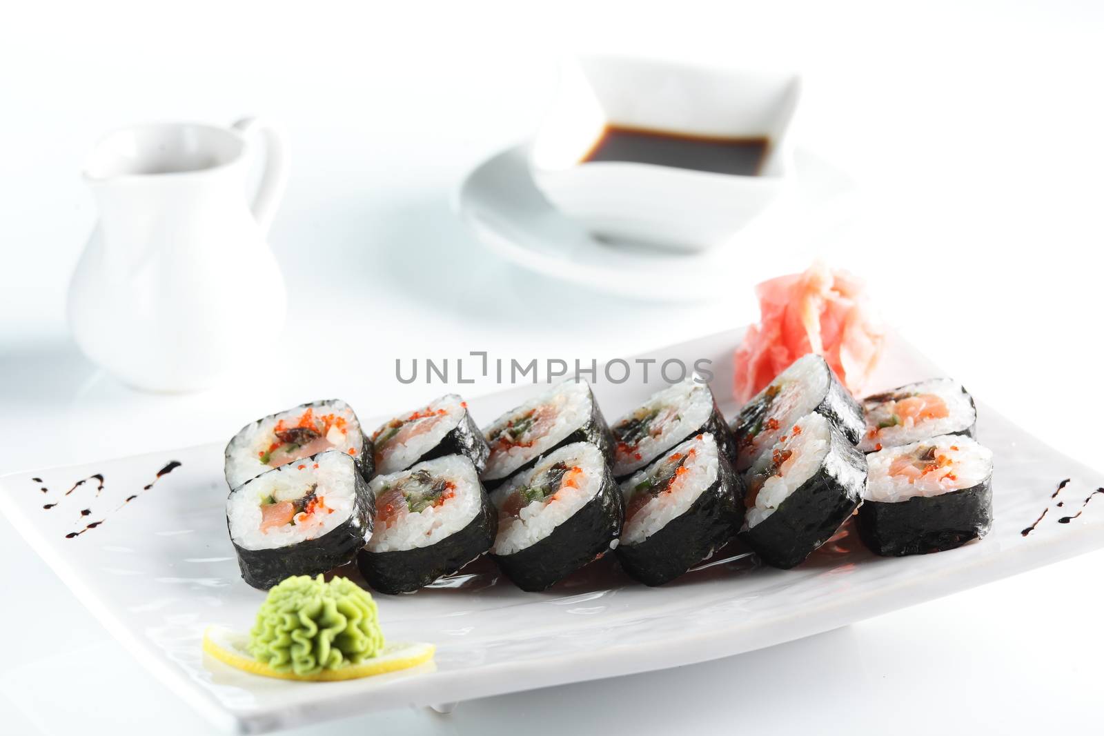 fresh and tasty sushi on bright background