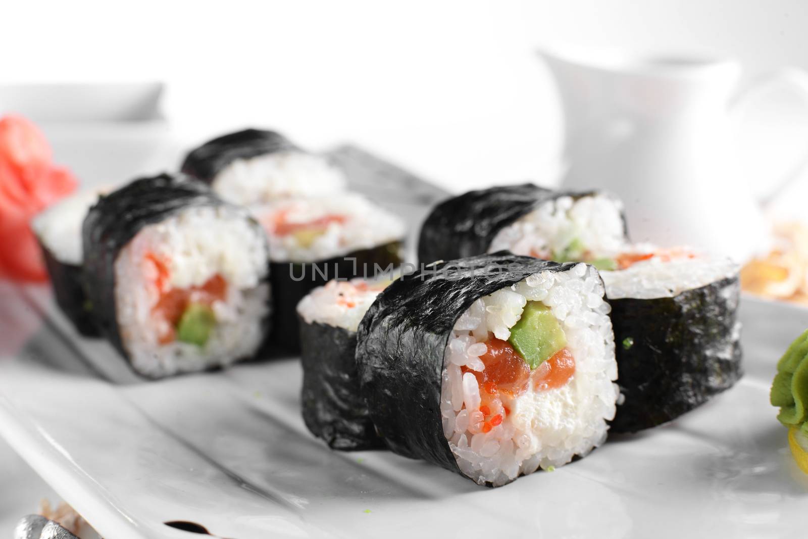 fresh and tasty sushi on bright background